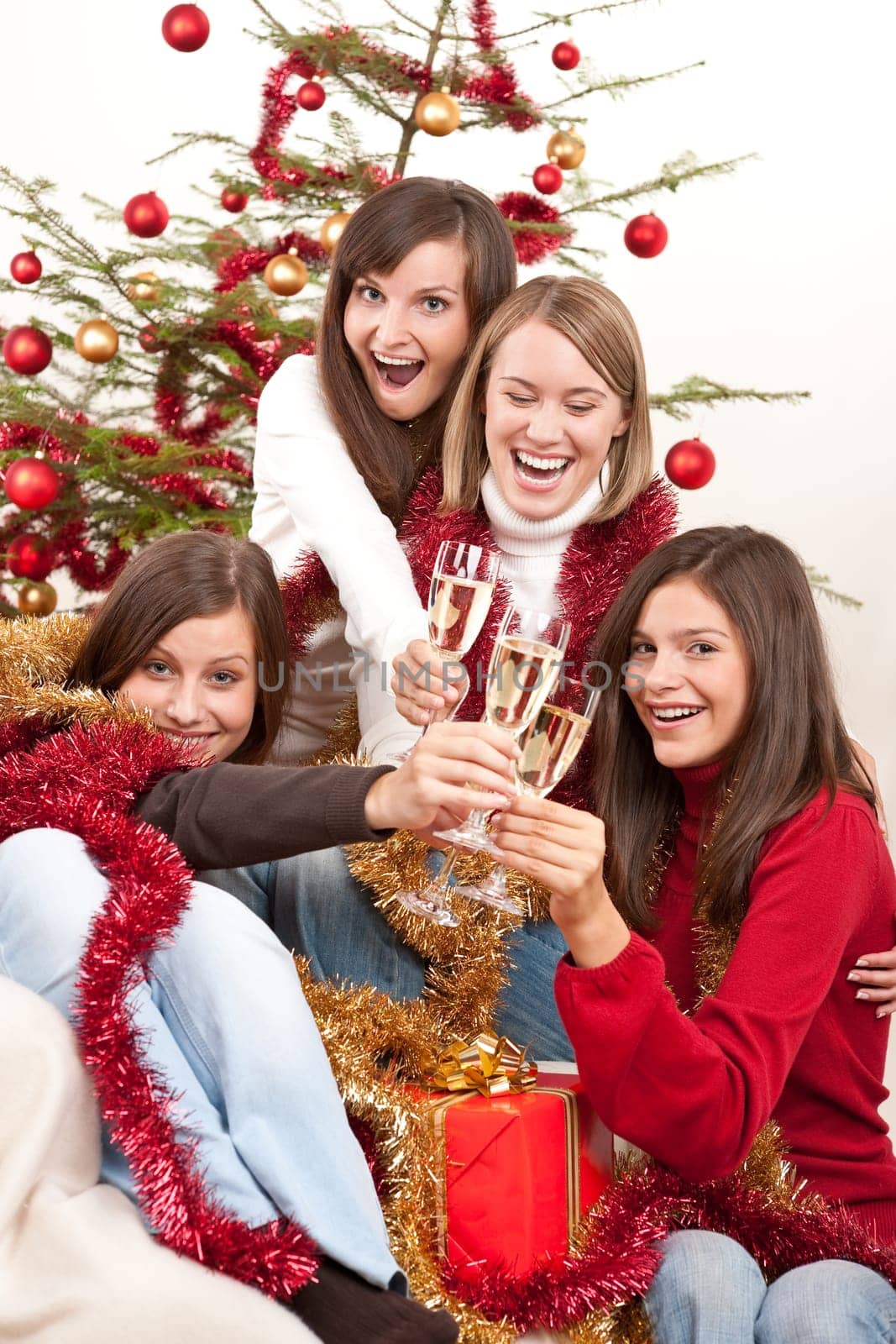 Four smiling women on Christmas