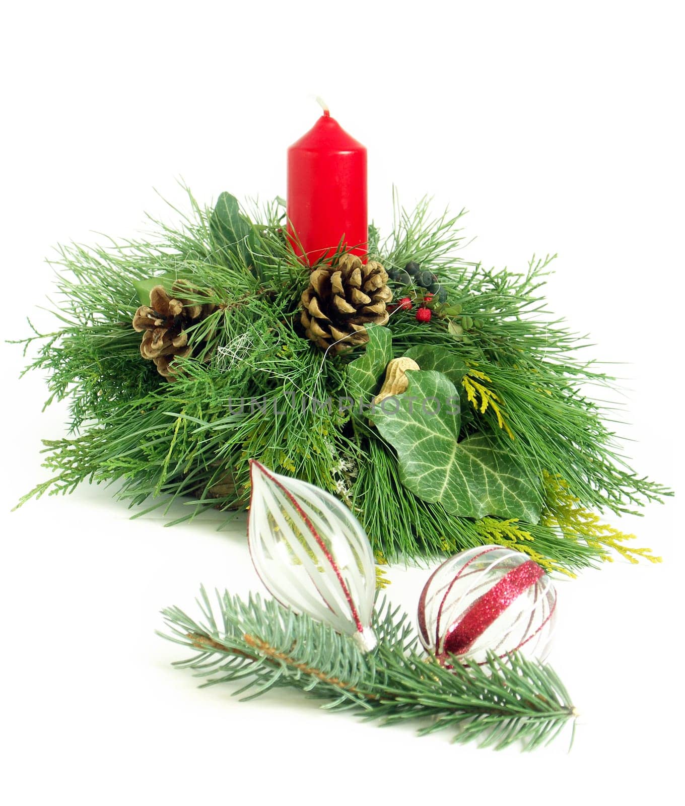 Christmas - wreath from fresh twigs and cones with red candle