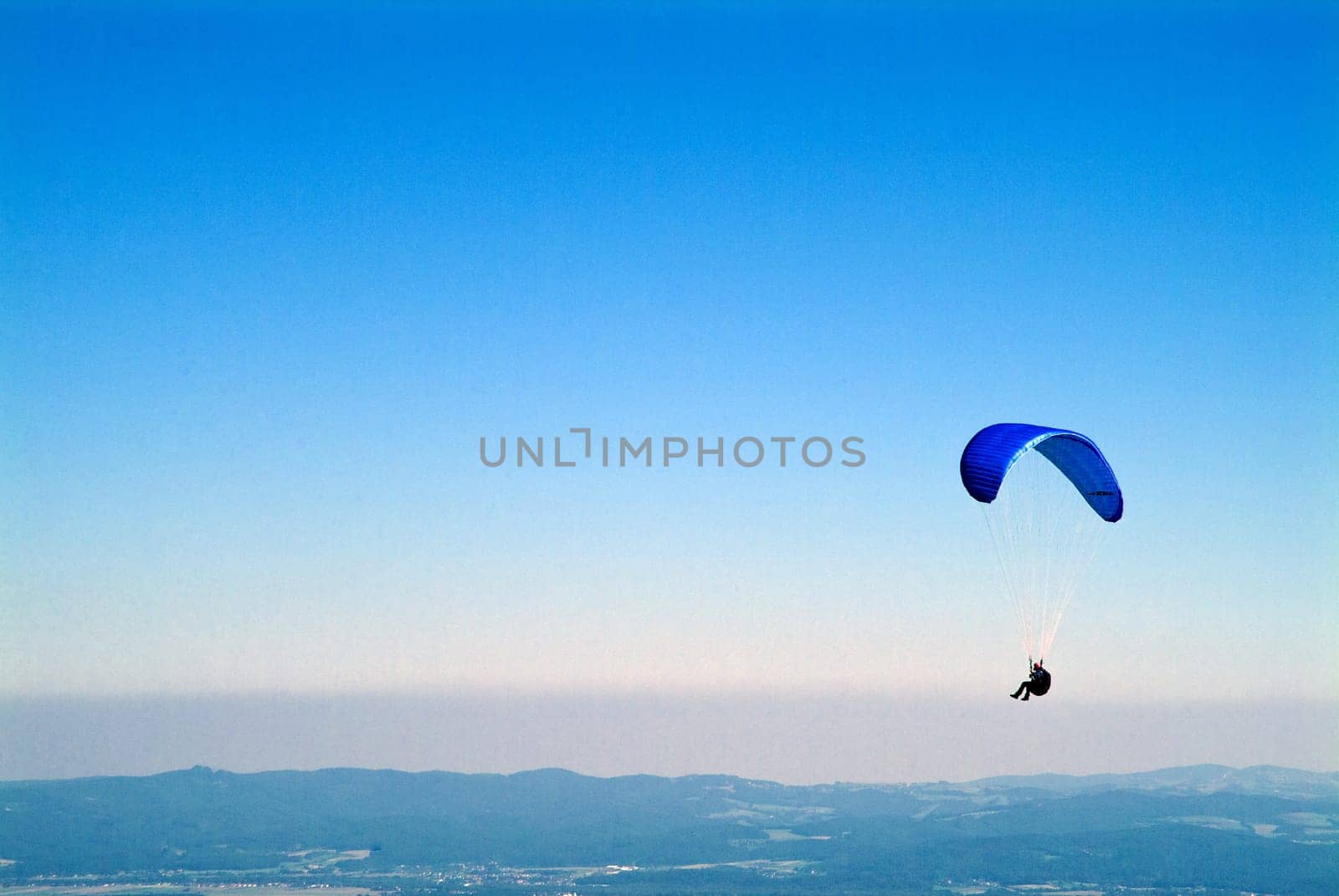 Hang gliders above the clouds
