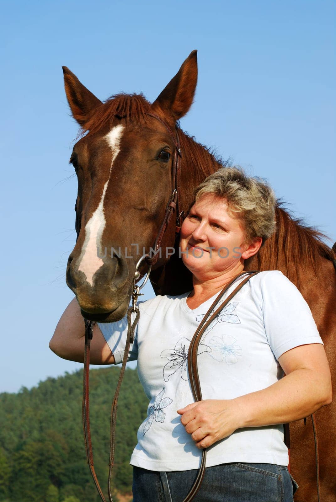Woman with riding pony mare