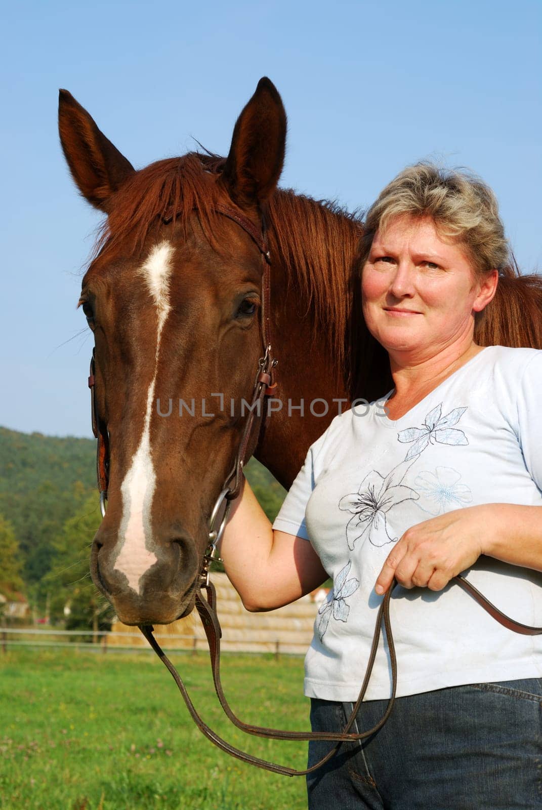 Woman with riding pony mare