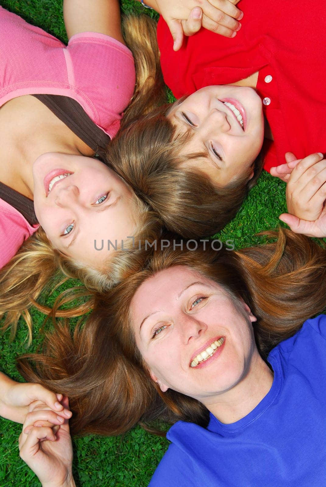 Family lying down on grass