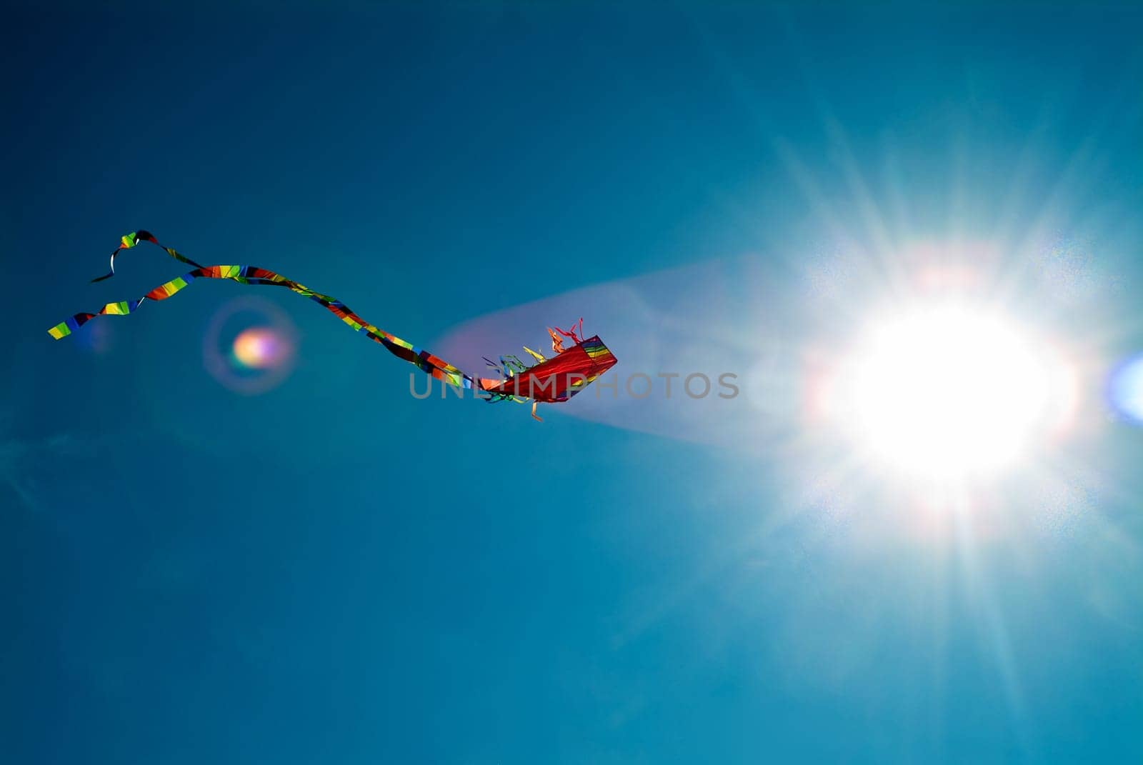 Dragon with tail and sun