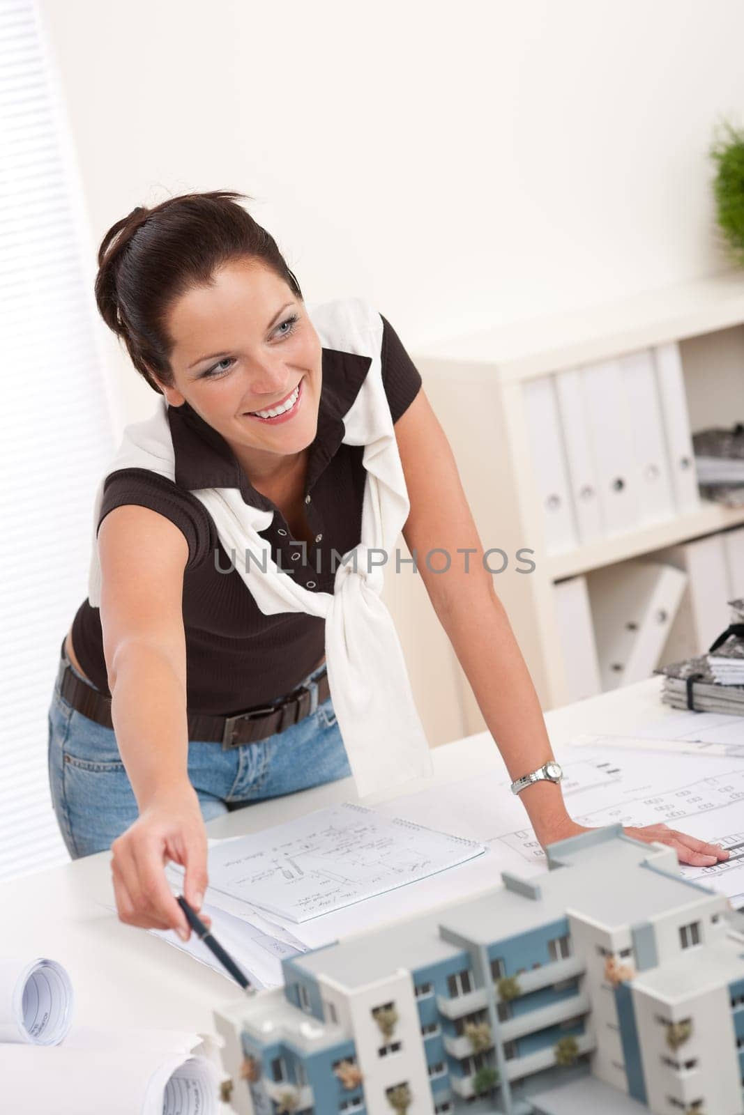 Young architect with architectural model