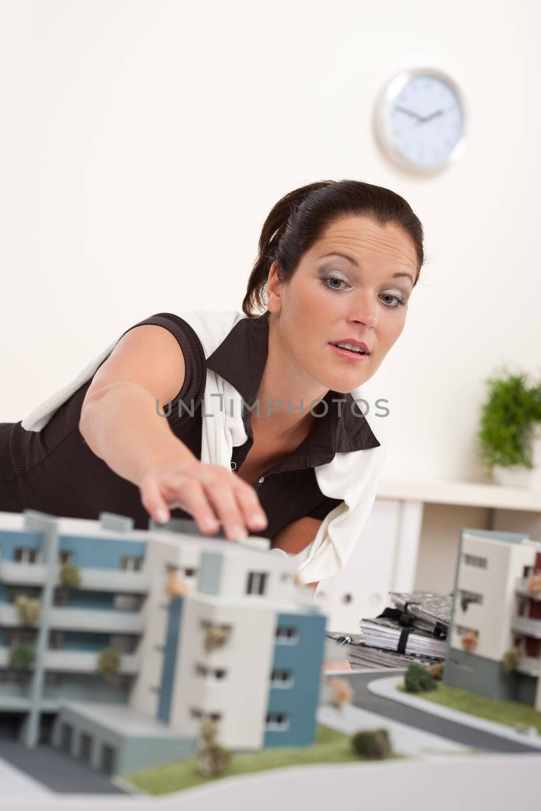 Young architect with architectural model