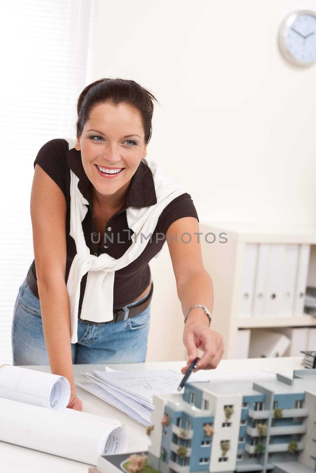 Young architect with architectural model