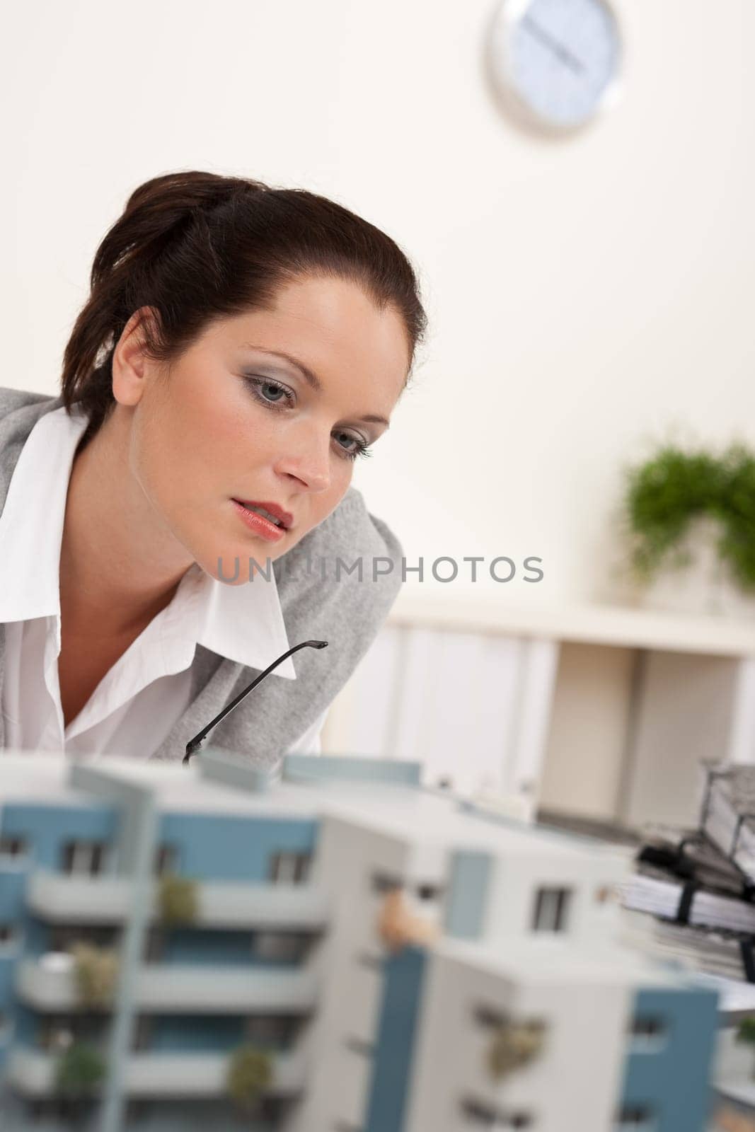 Young architect with architectural model