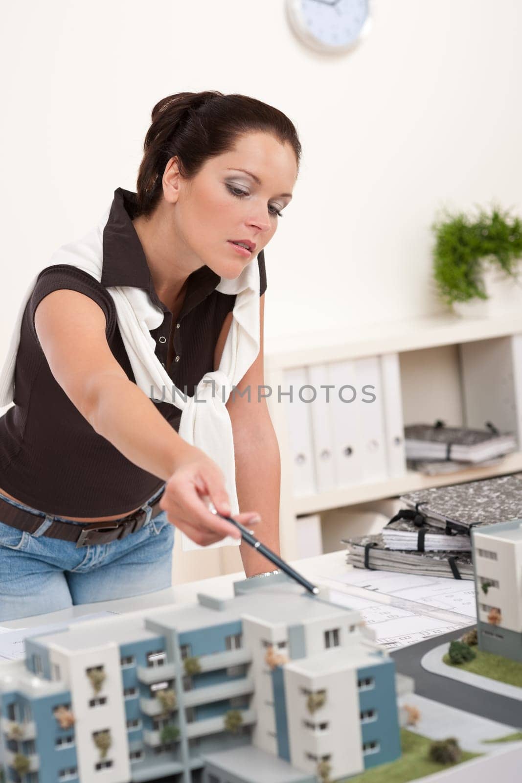 Young architect with architectural model