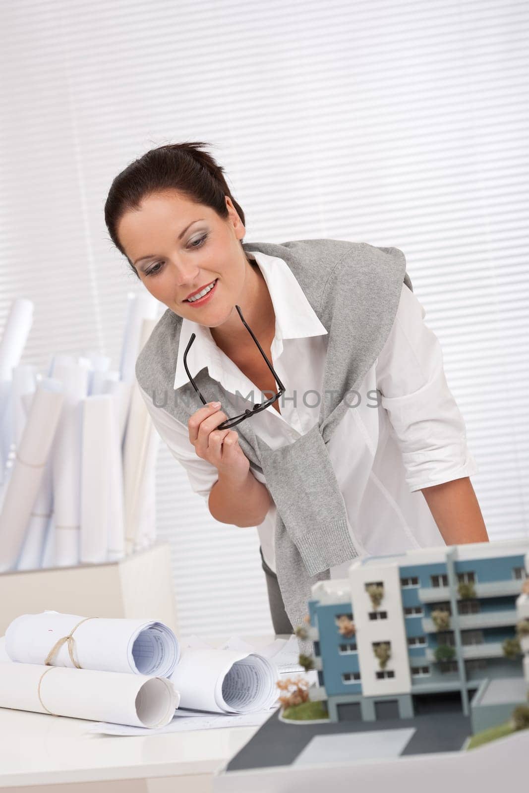 Young architect with architectural model