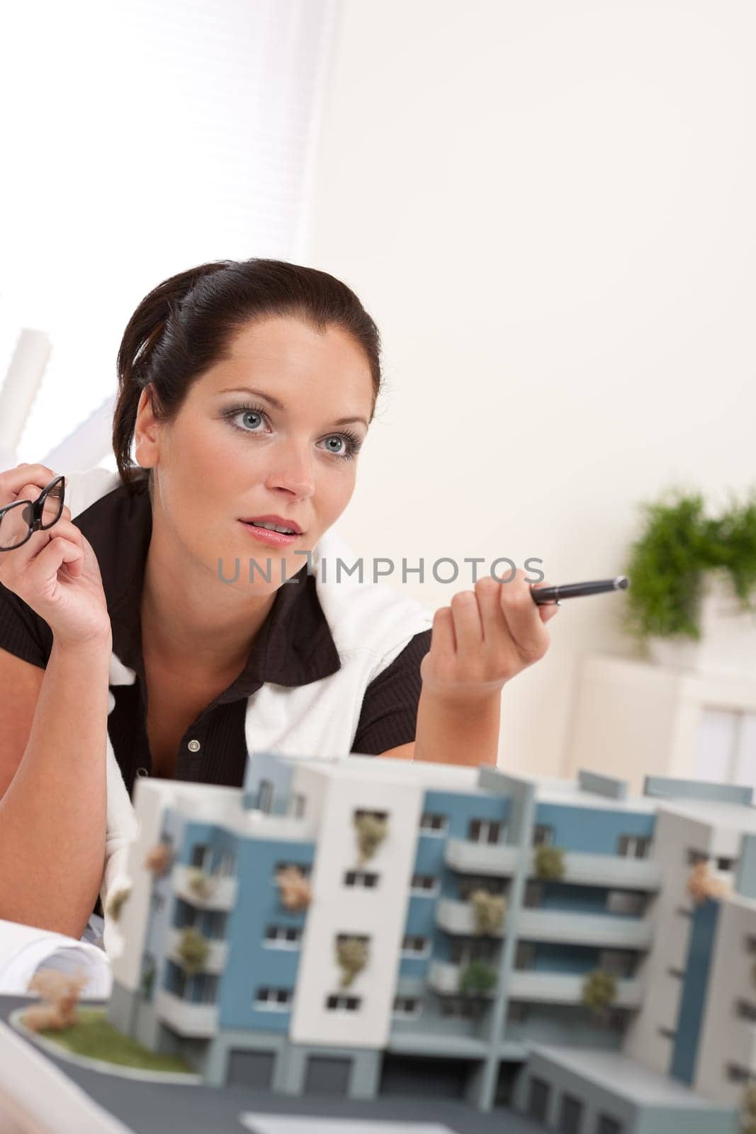 Young architect with architectural model