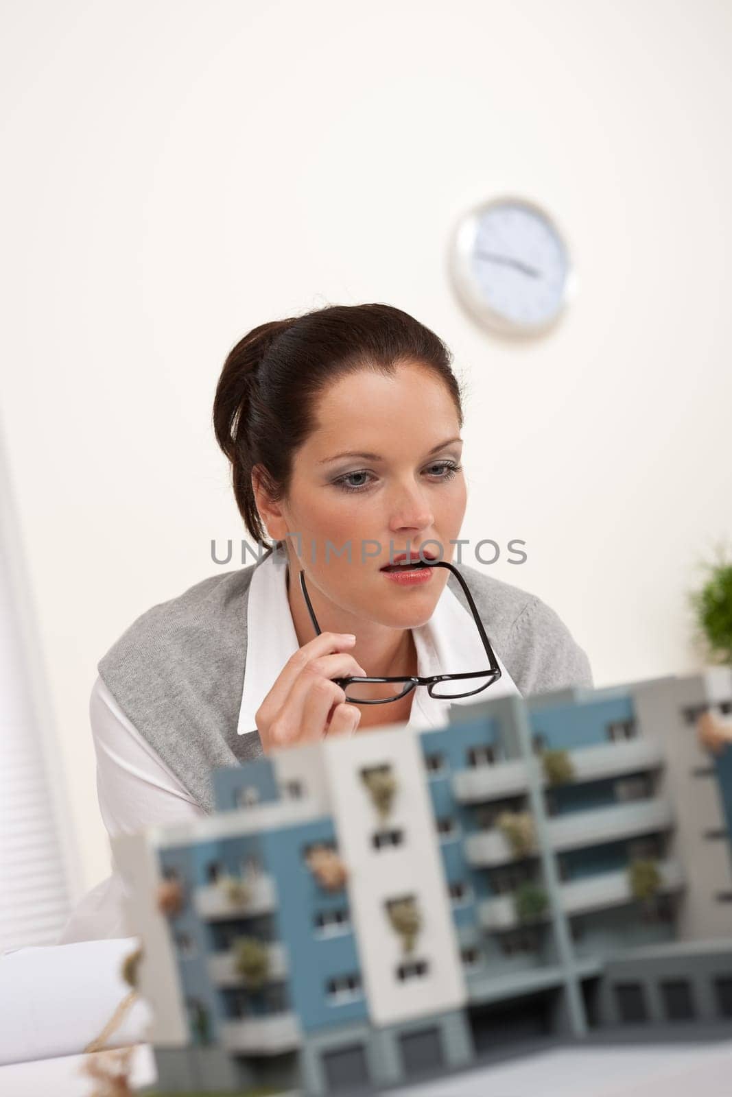 Young architect with architectural model