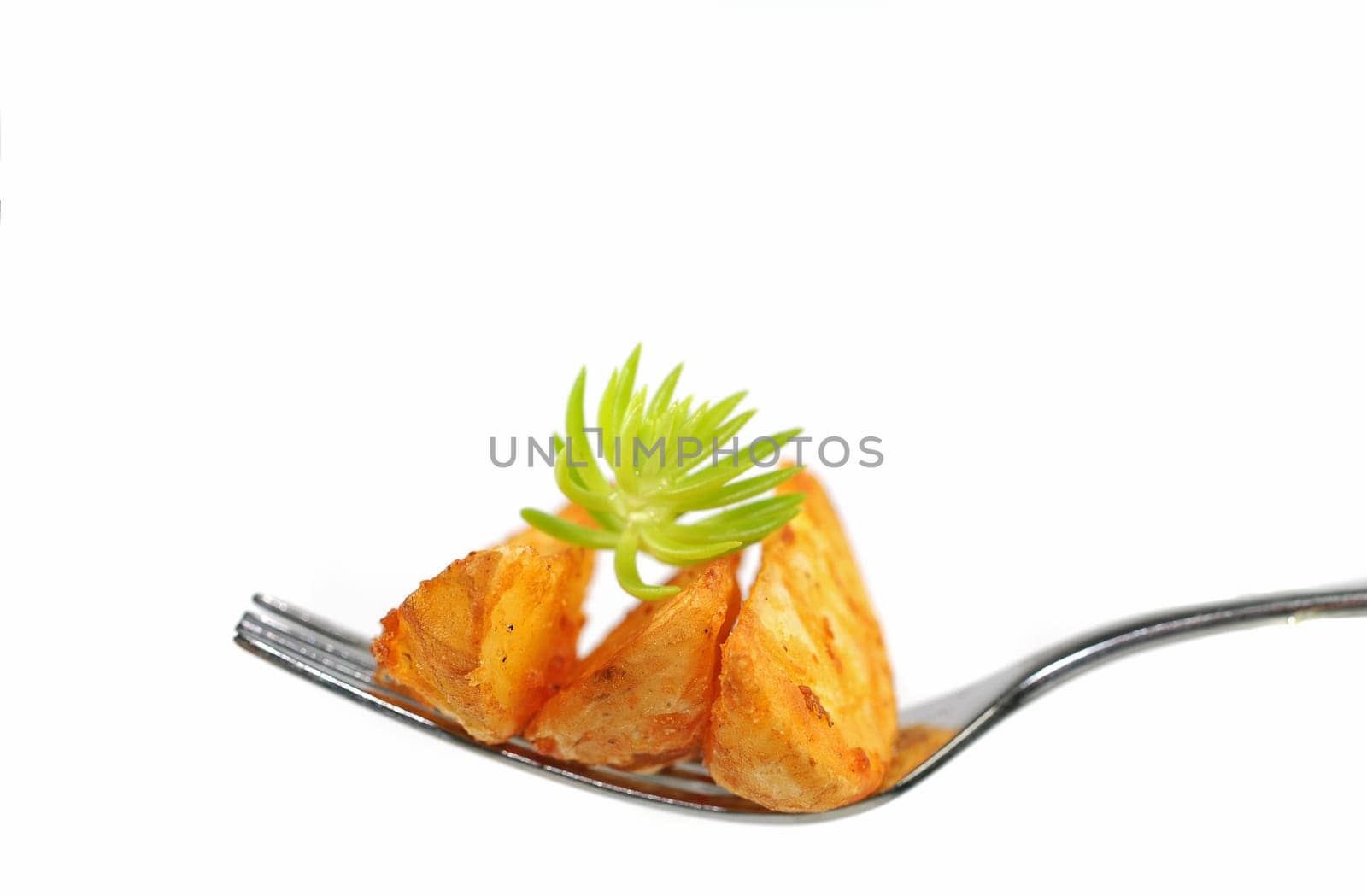 Potato wedges on a fork