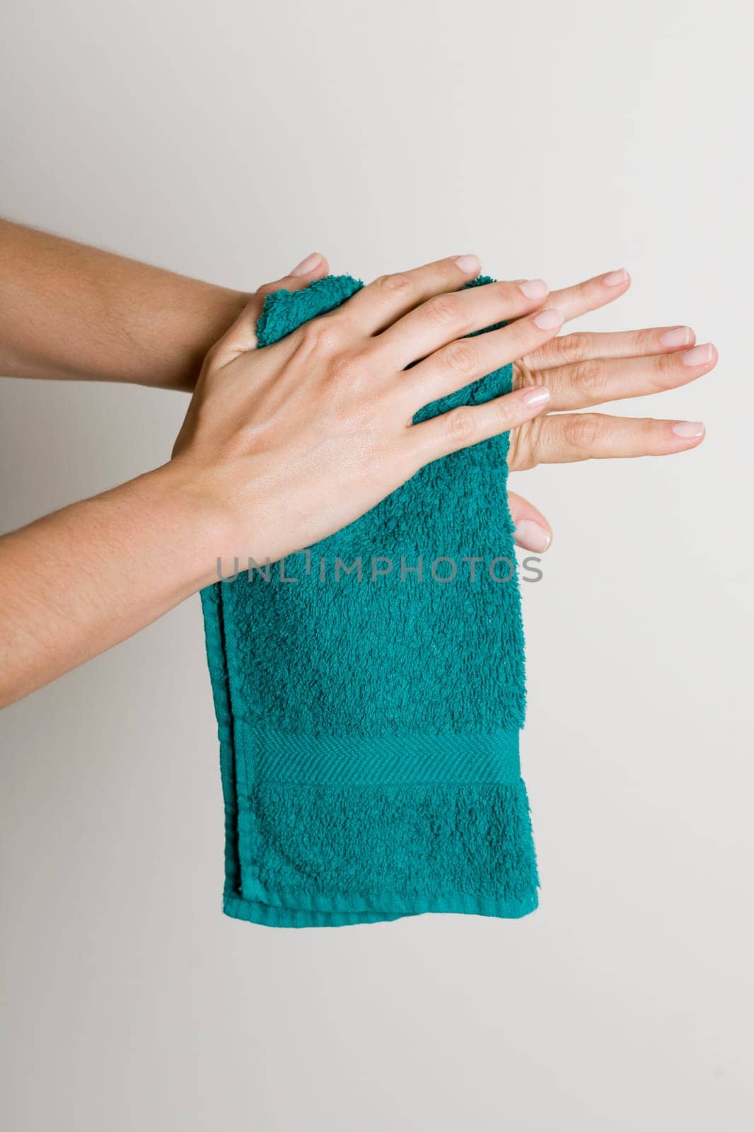 Drying hands with a towel