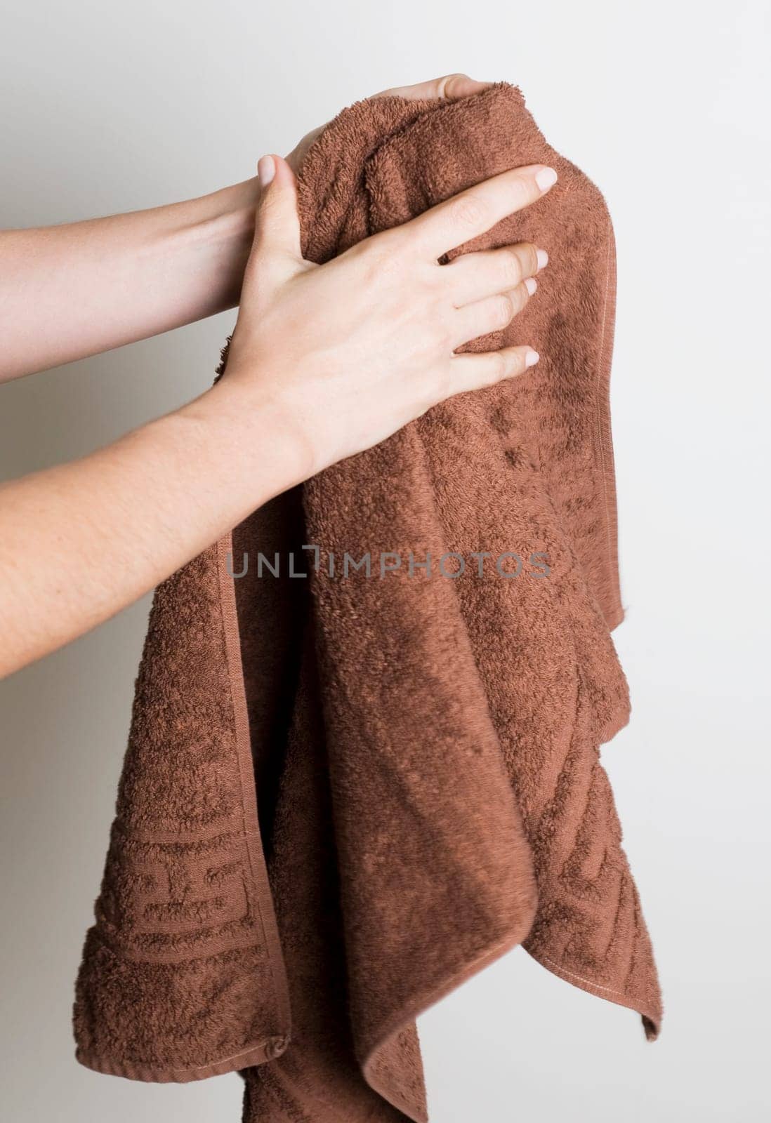 Drying hands with a towel
