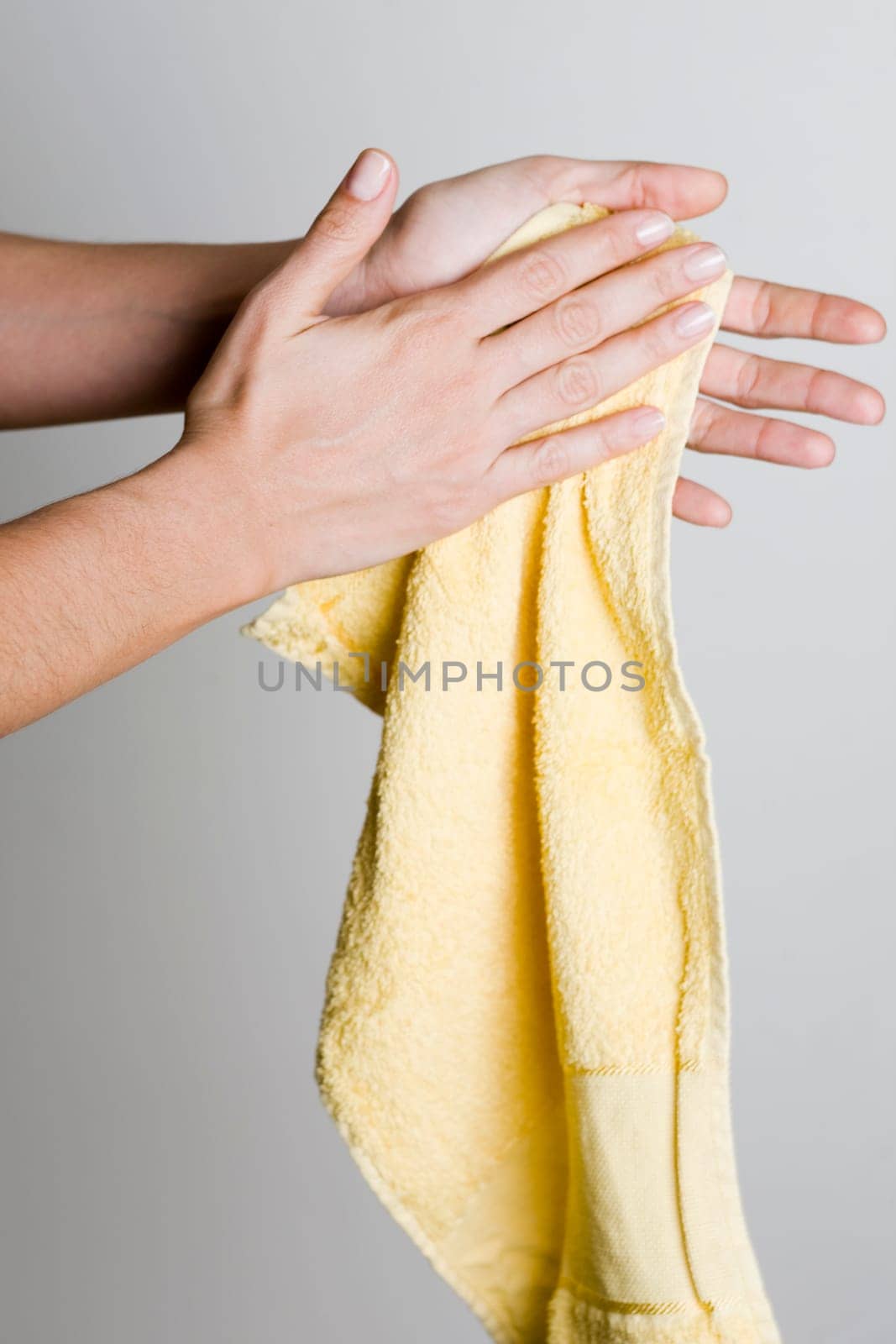 Drying hands with a towel