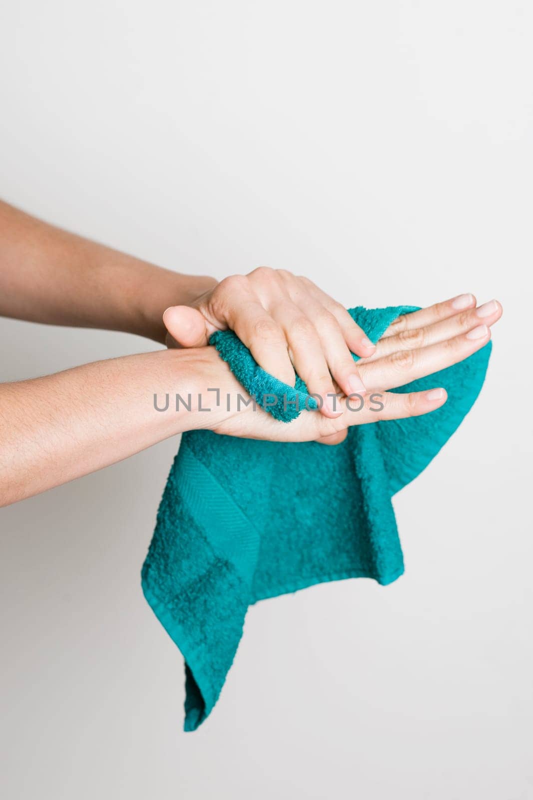 Drying hands with a towel