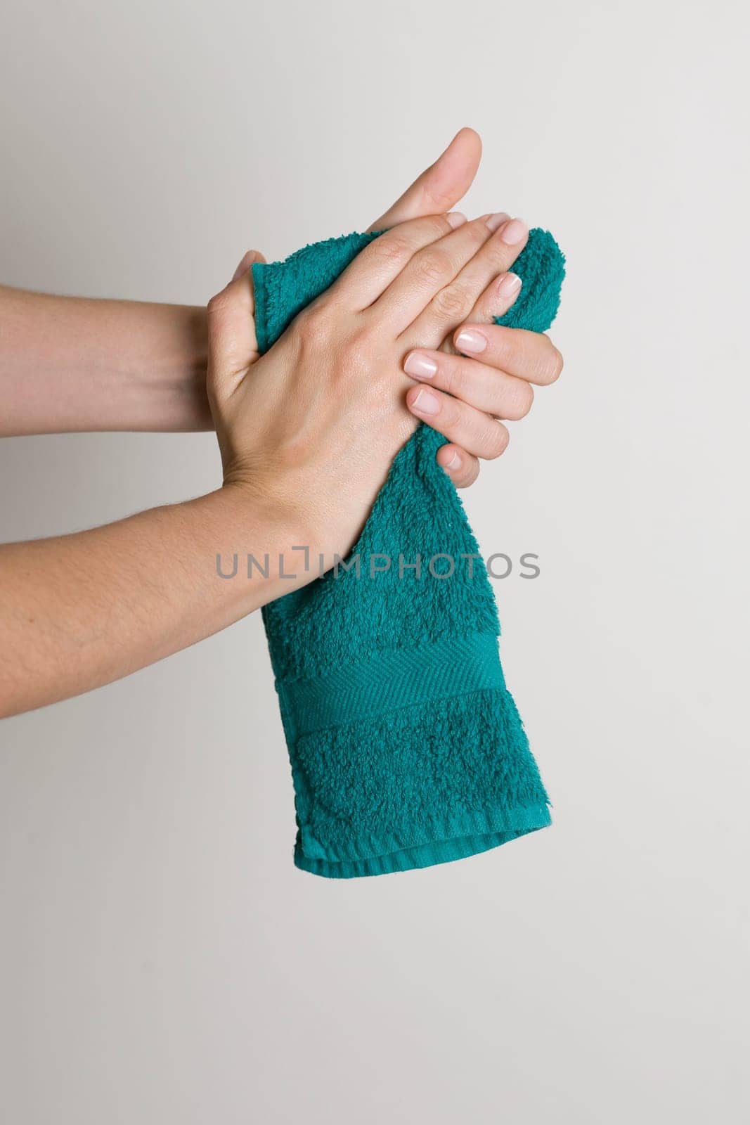 Drying hands with a towel