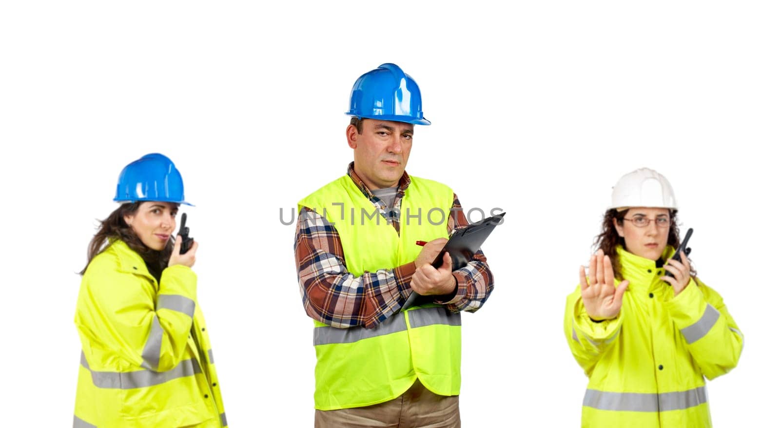 Construction workers talking with a walkie talkie