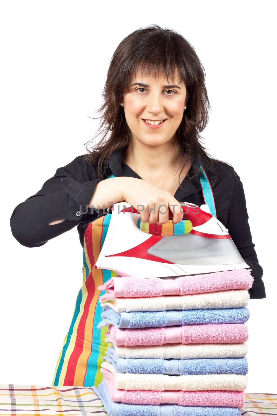 Housewife close to towels stacked