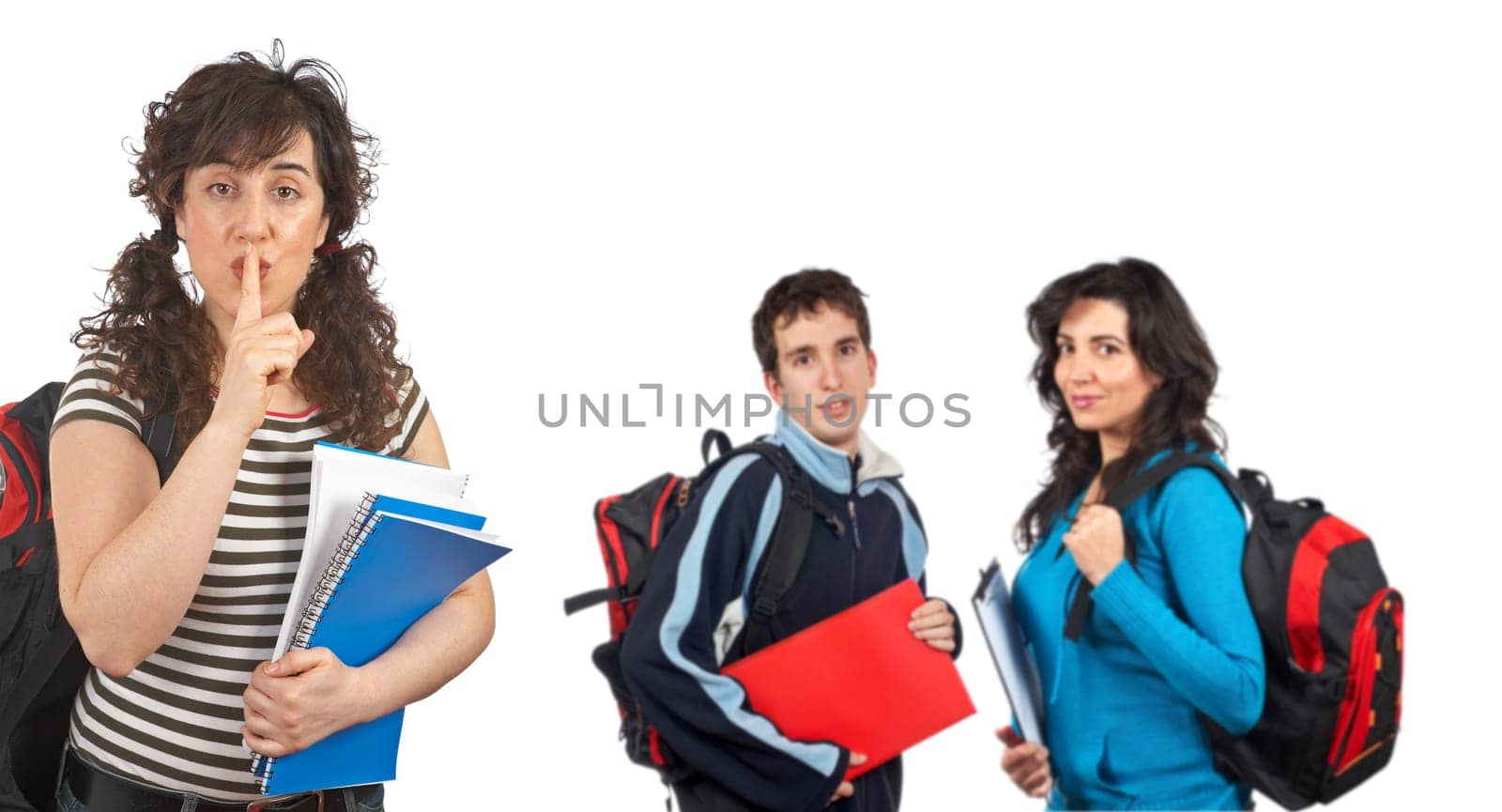 Three students with books and backpacks