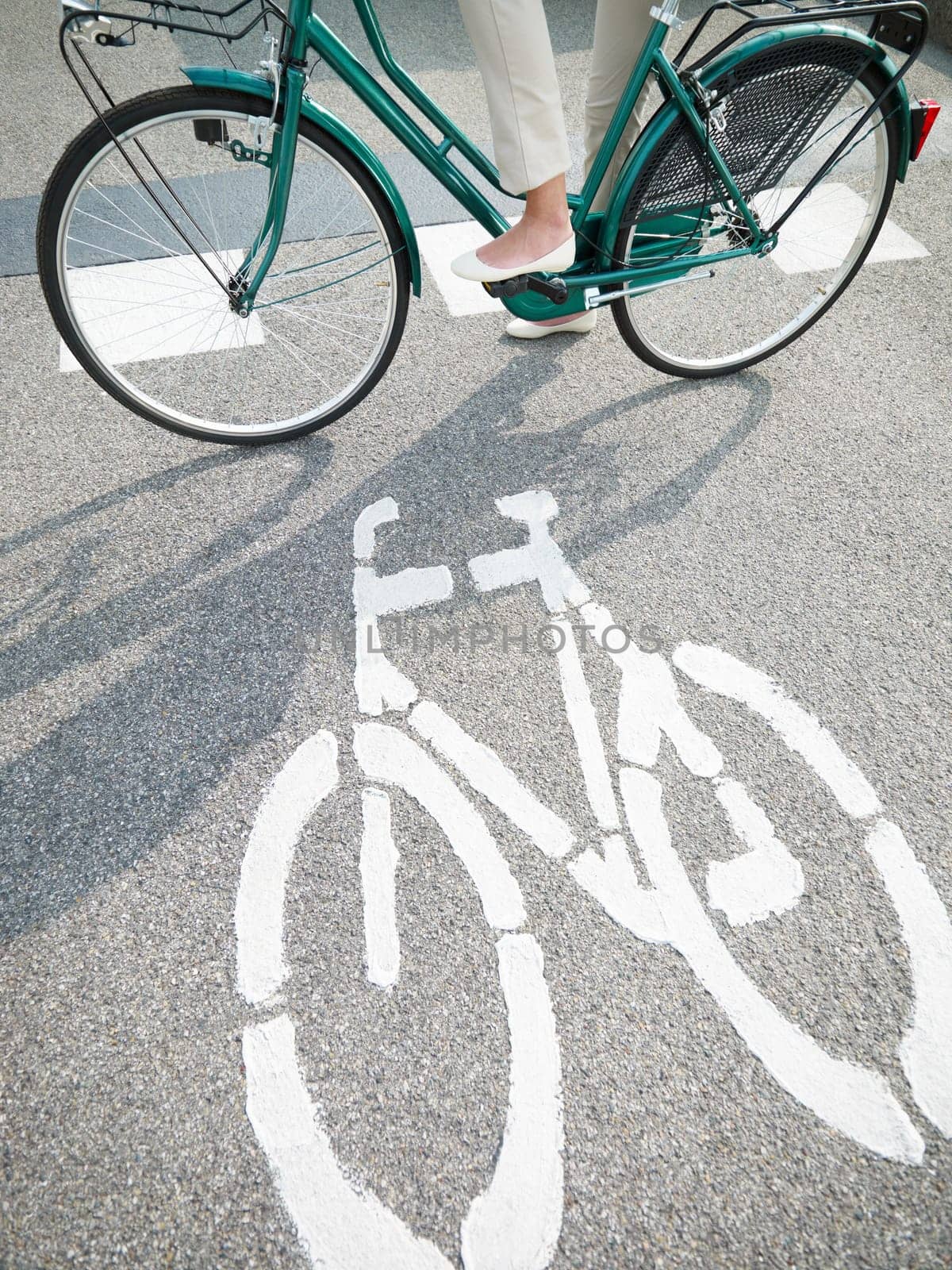 cropped view of woman commuting on bicycle
