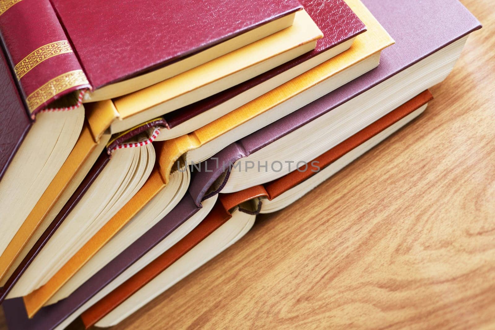 pile of books and pencil on desk. Copy space