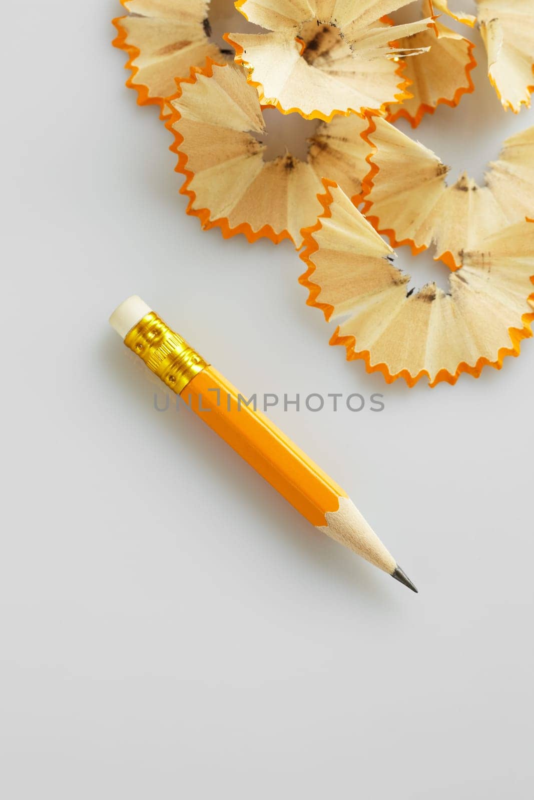 sharpened pencil on white background. High angle view