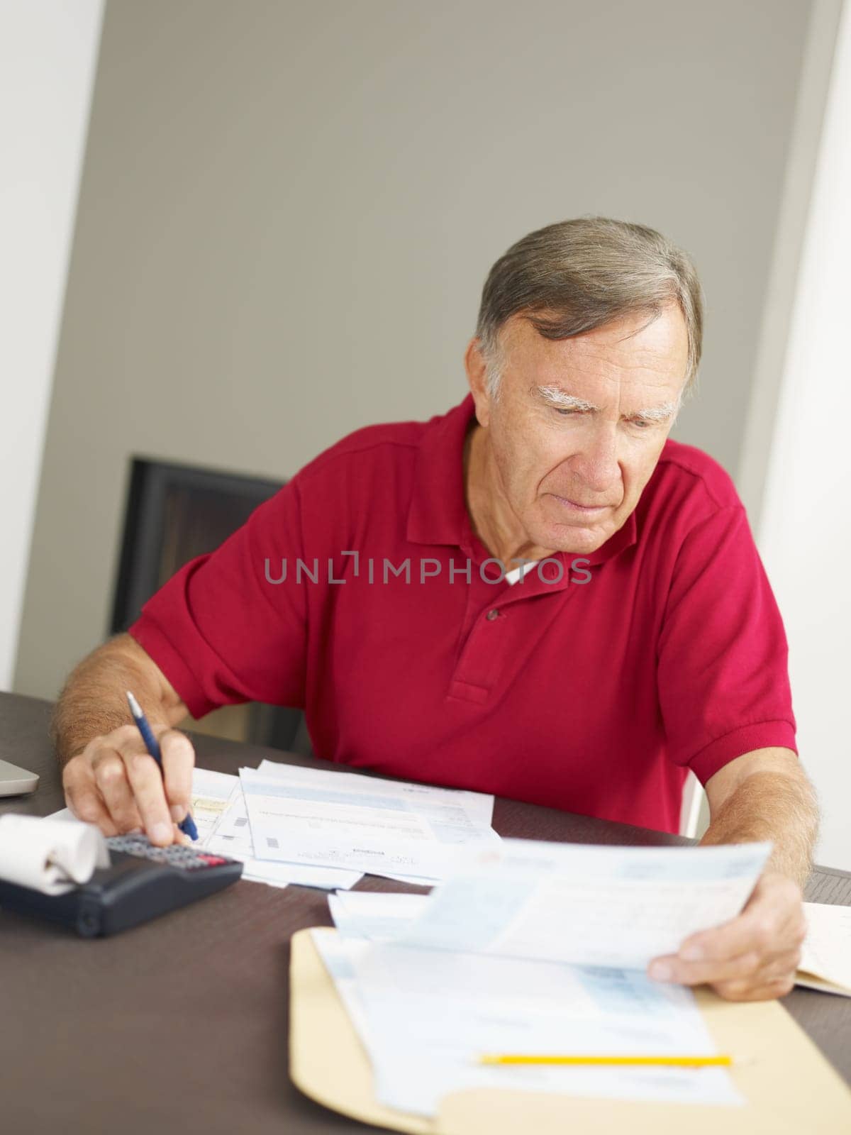 Senior man checking home finances. Copy space