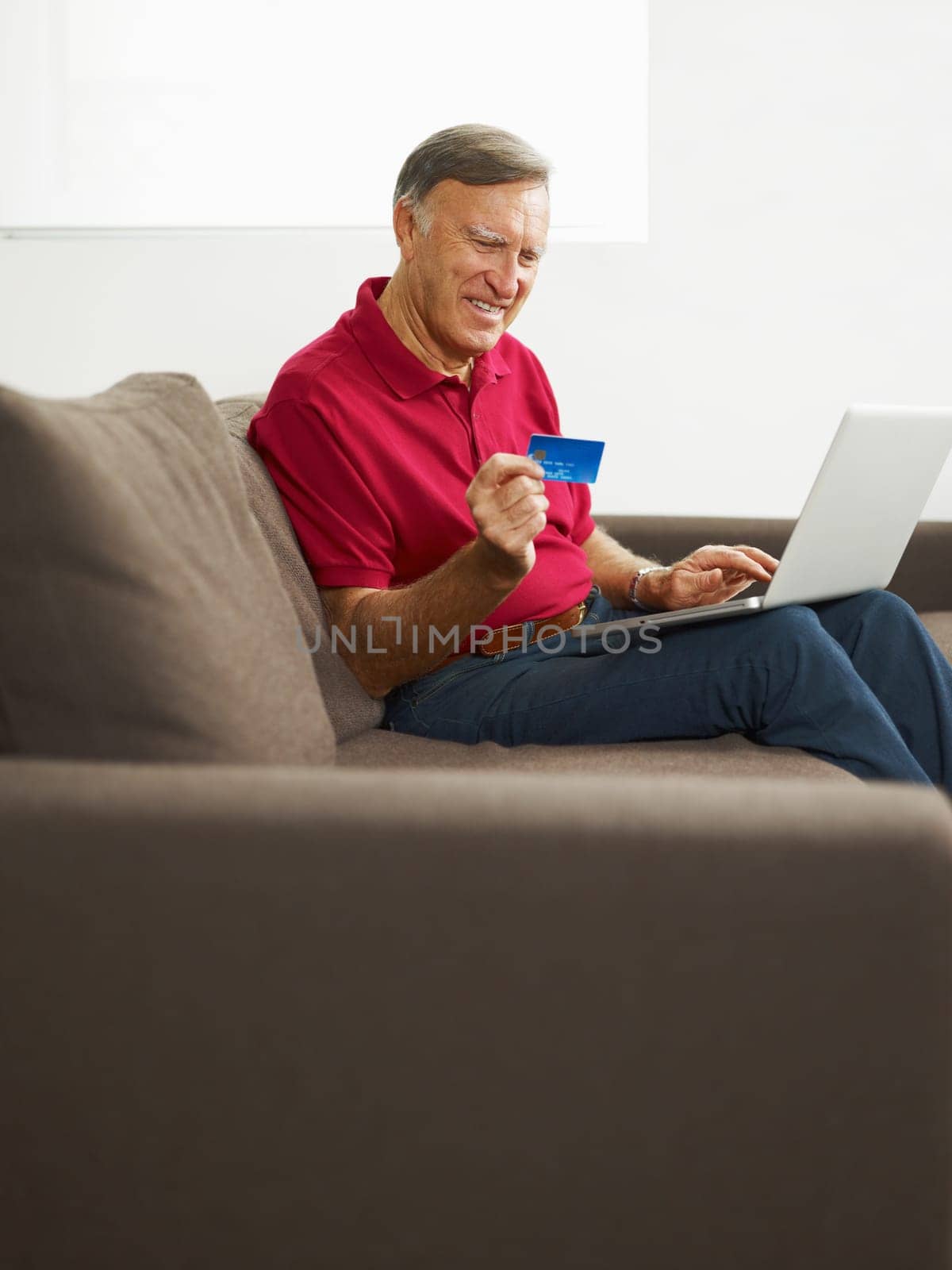 senior man with laptop computer and credit card. Copy space