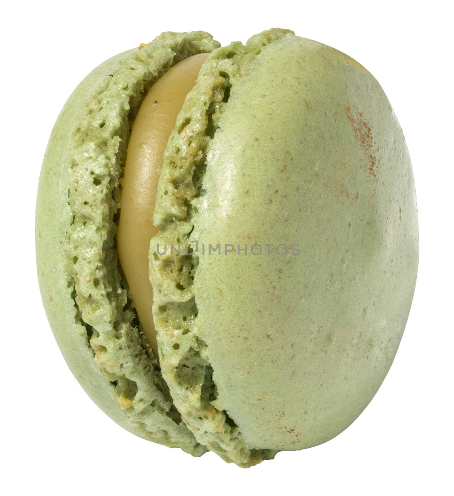 Green pistachio macaron on white isolated background by ndanko