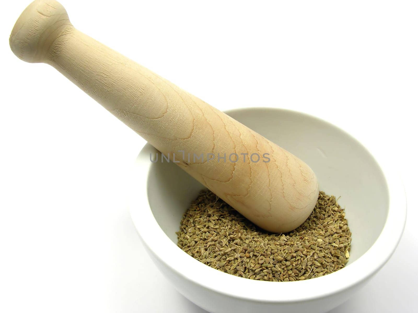 Dried fennel in porcelain bowl with mortar