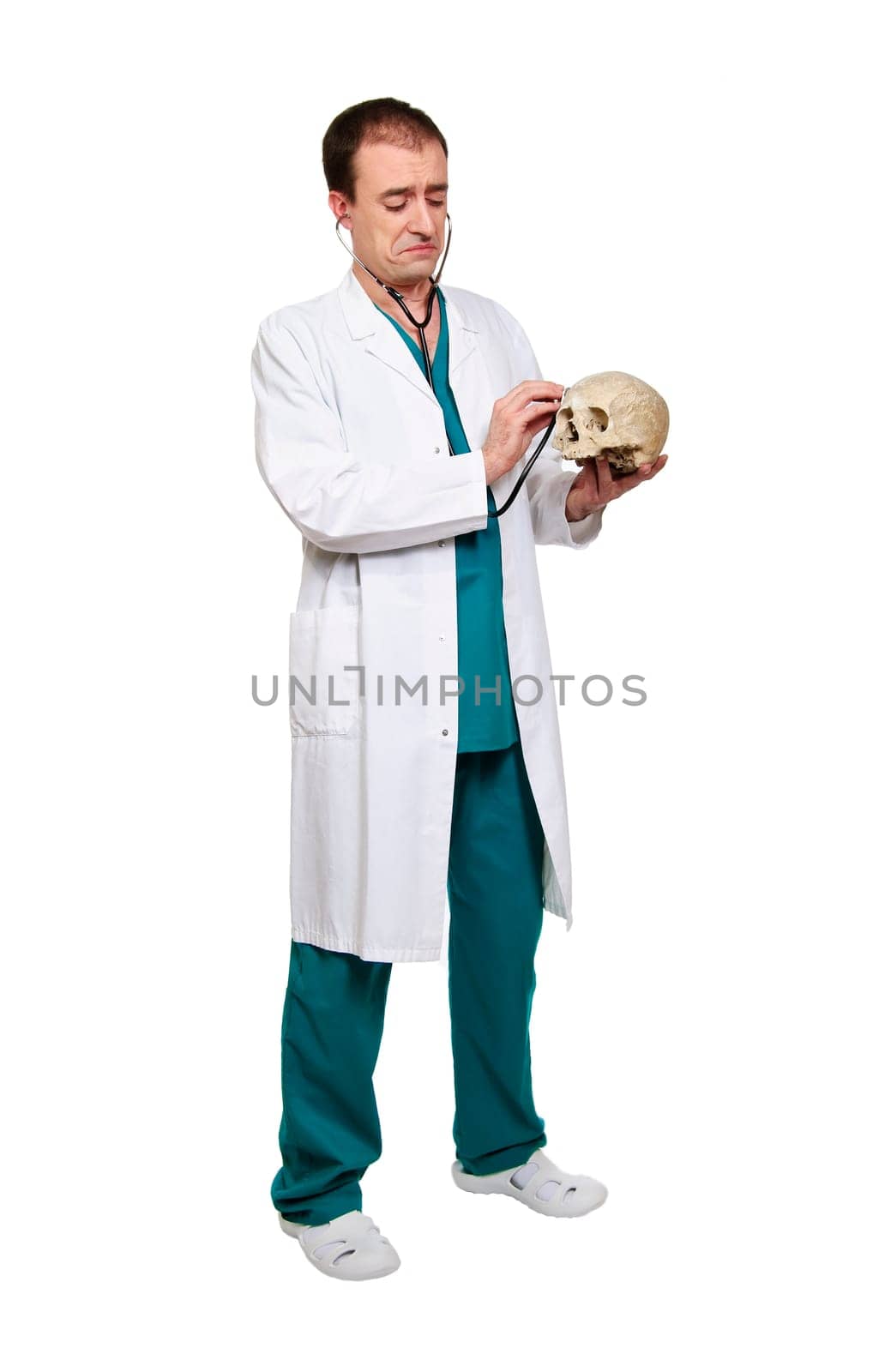 portrait of young caucasian  funny doctor isolated on white