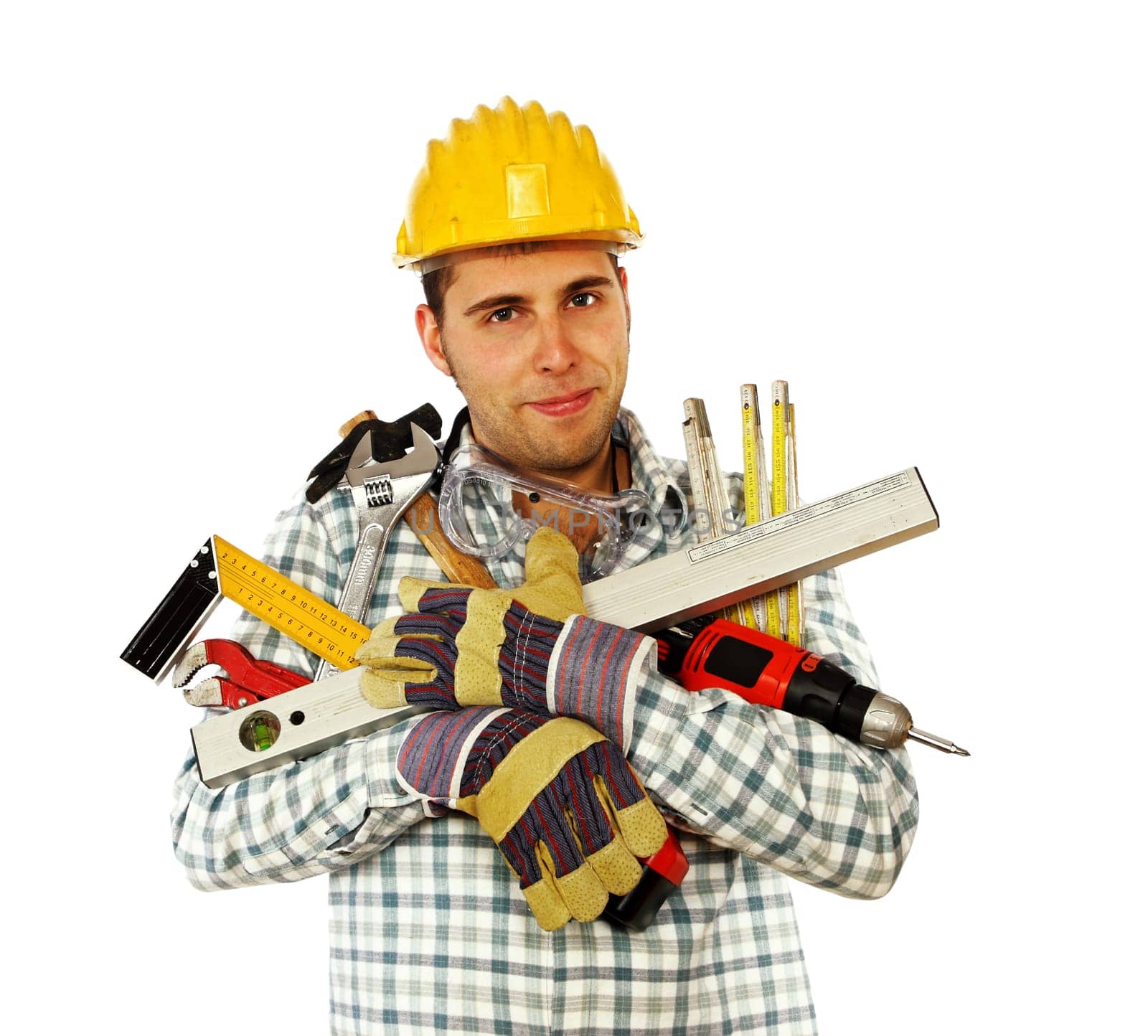 portrait of young caucasian handyman with lots of different tools