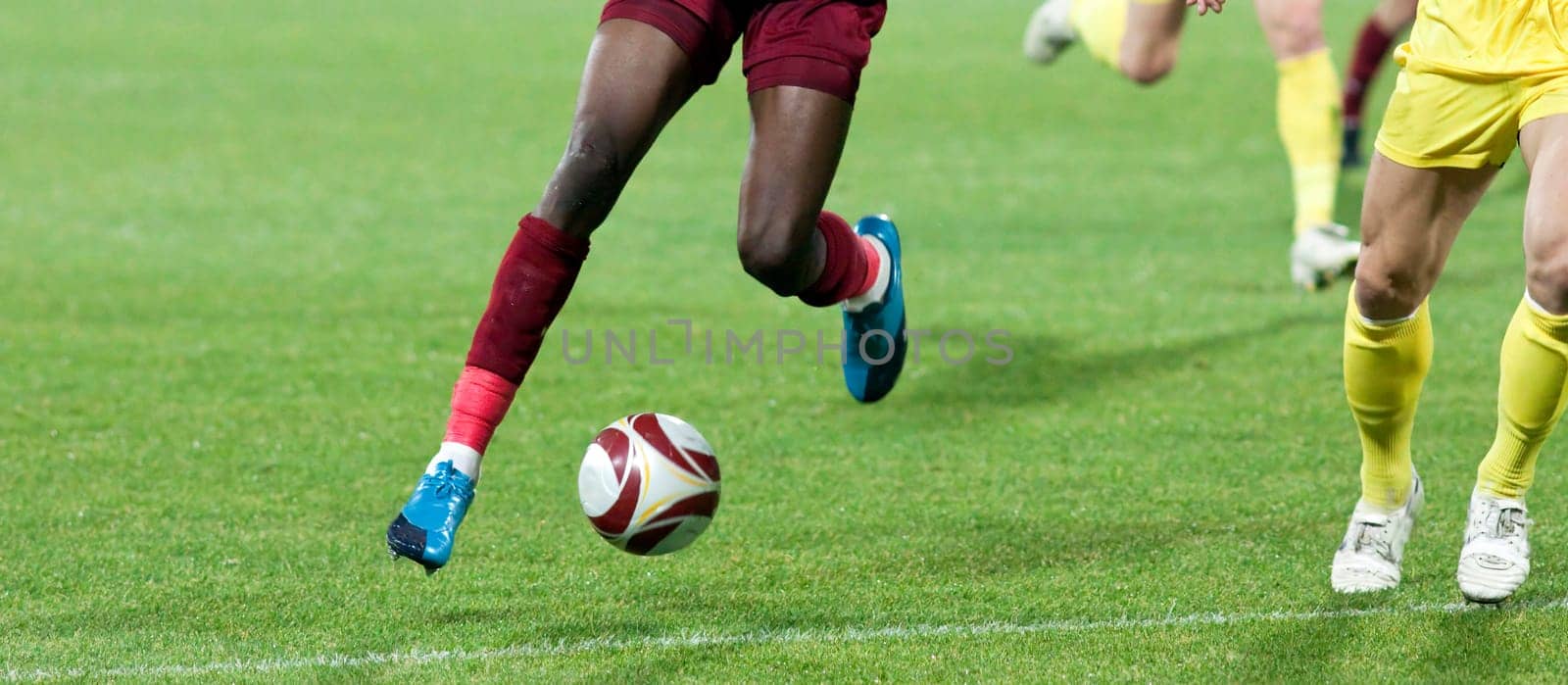 Soccer player kicking the ball