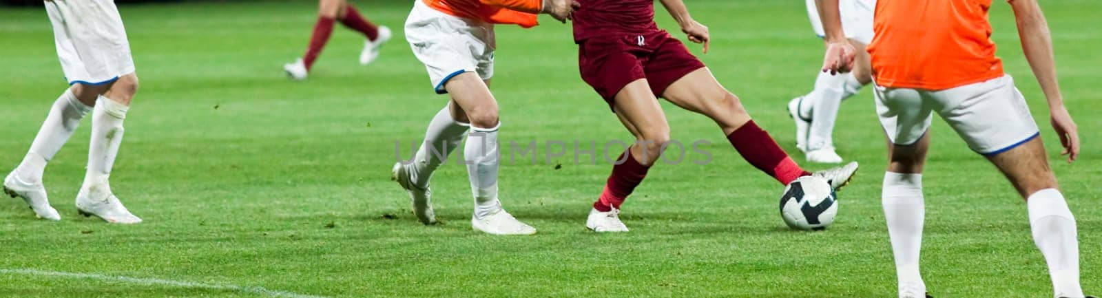 Soccer players fighting for the ball