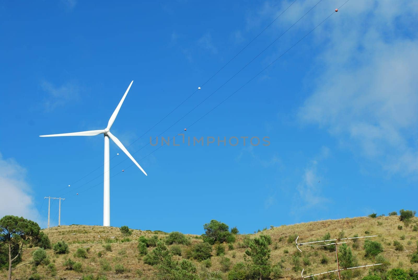 Wind turbine on the top of a mountain