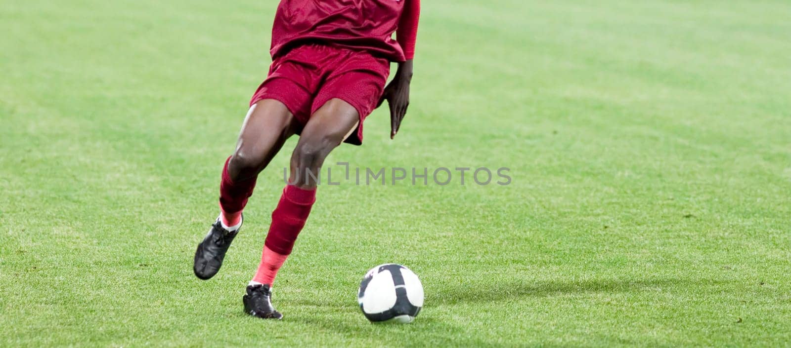 Soccer player kicking the ball