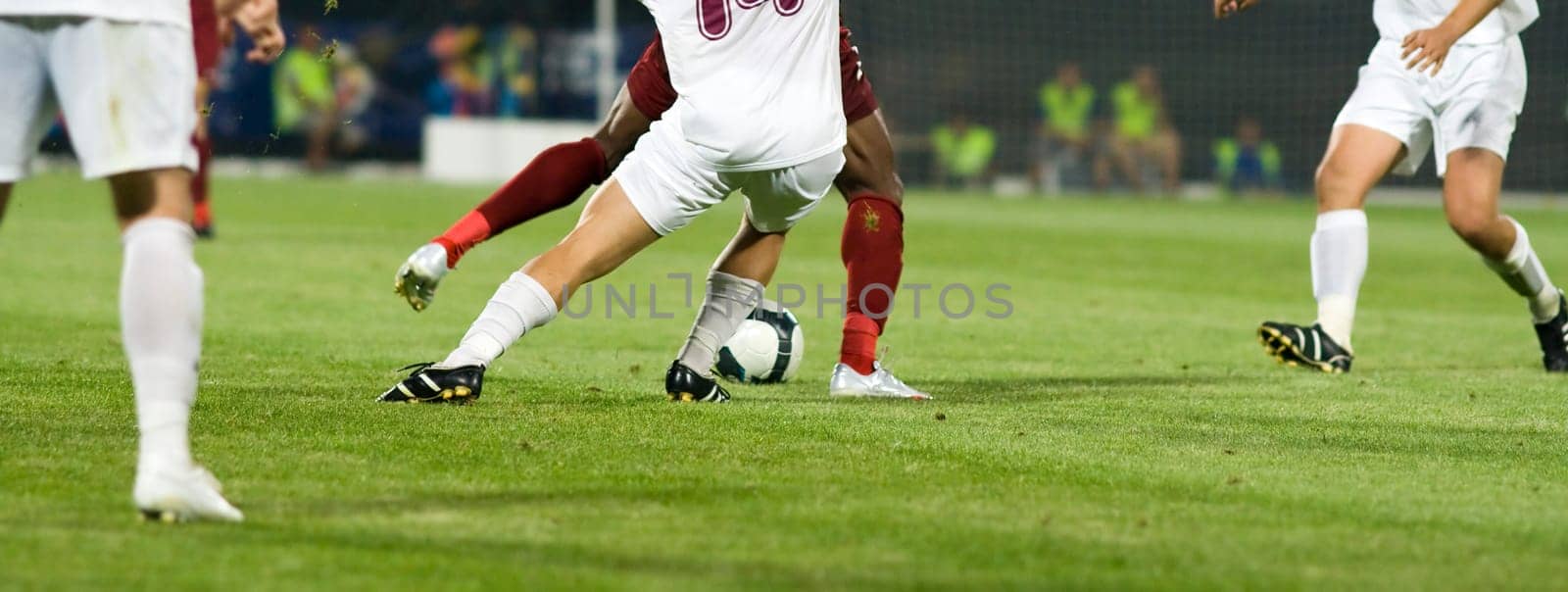 Soccer players fighting for the ball