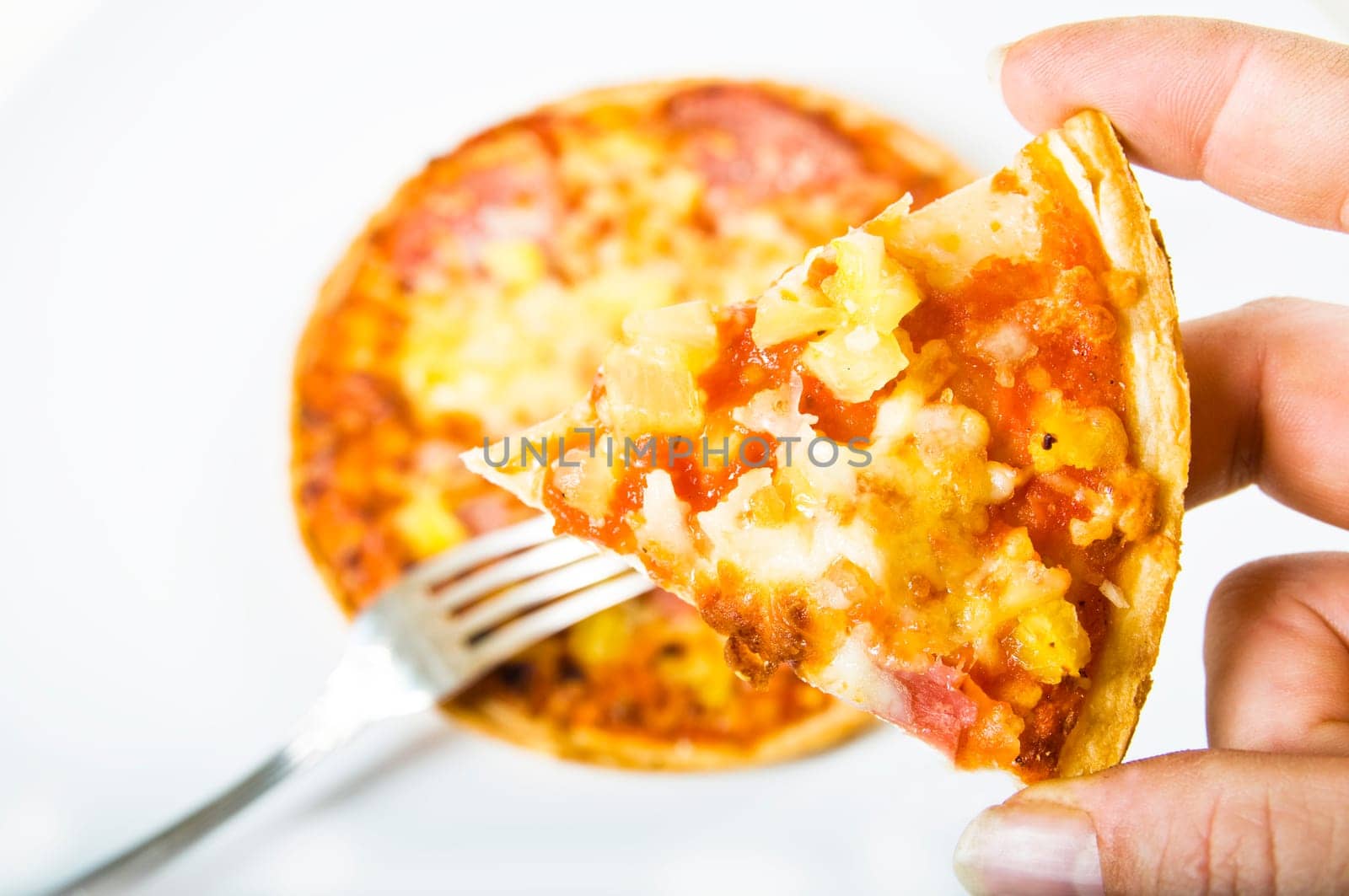 Pizza Hawaii against white background