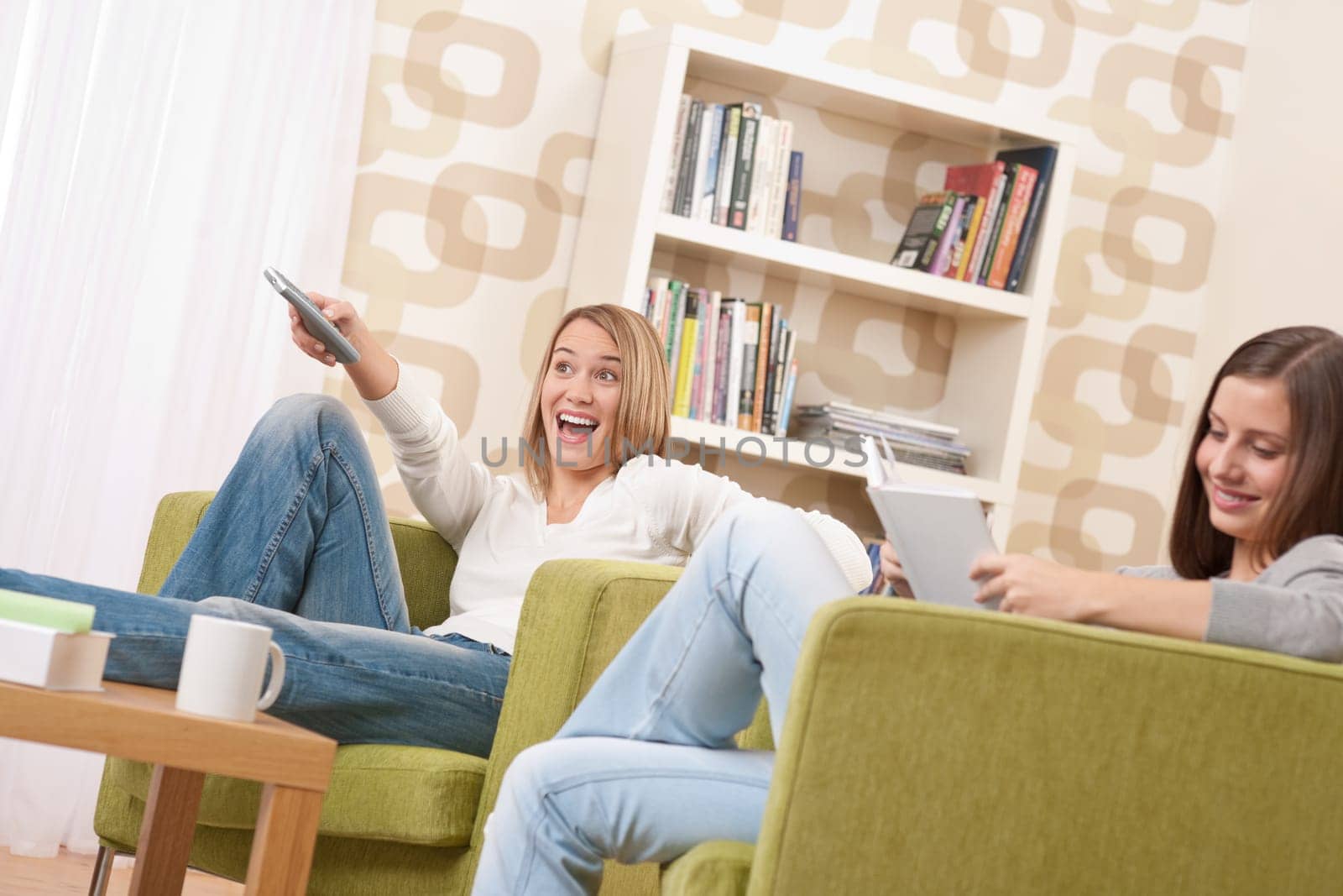 Students - Two female student relaxing home