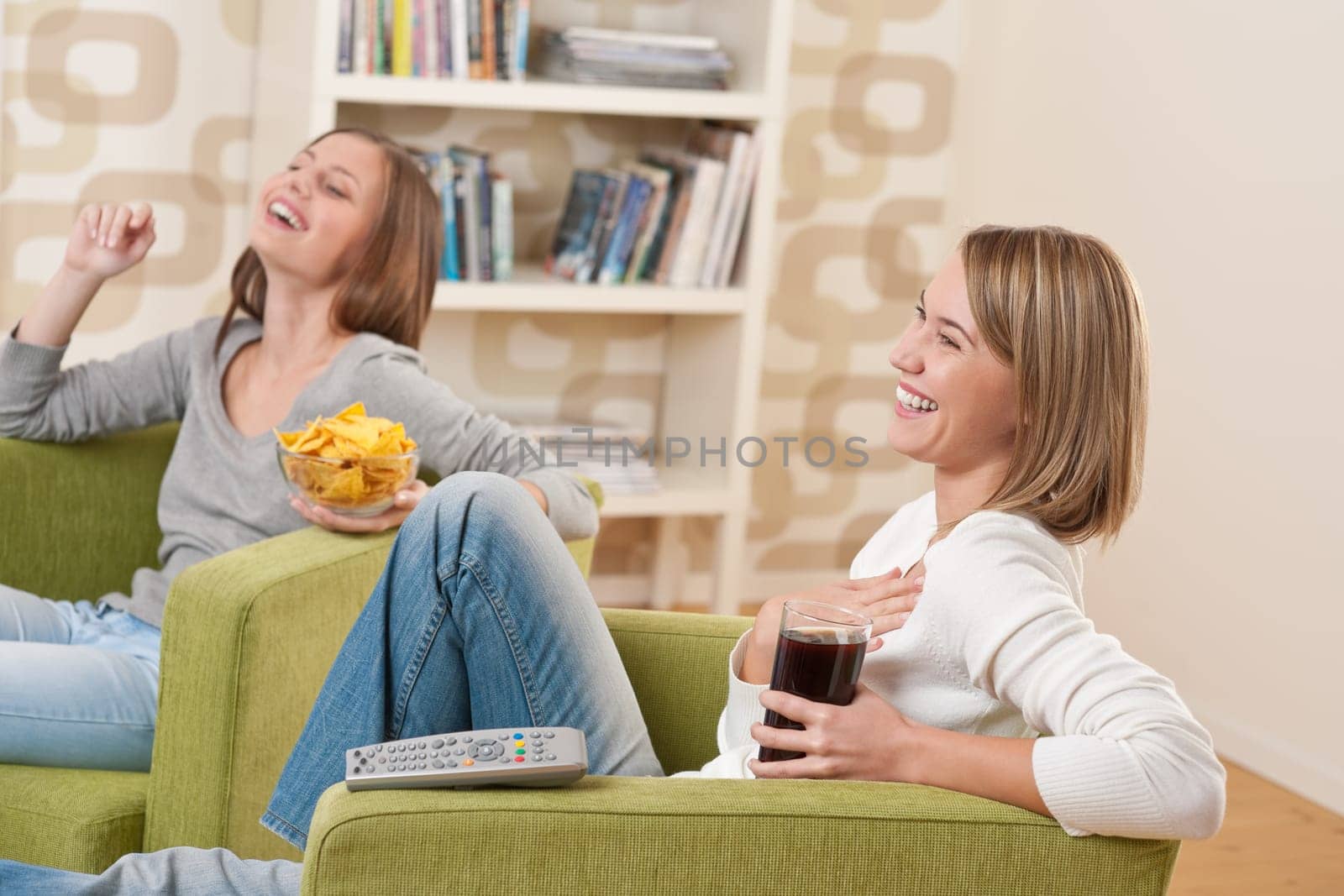 Two female students watching television