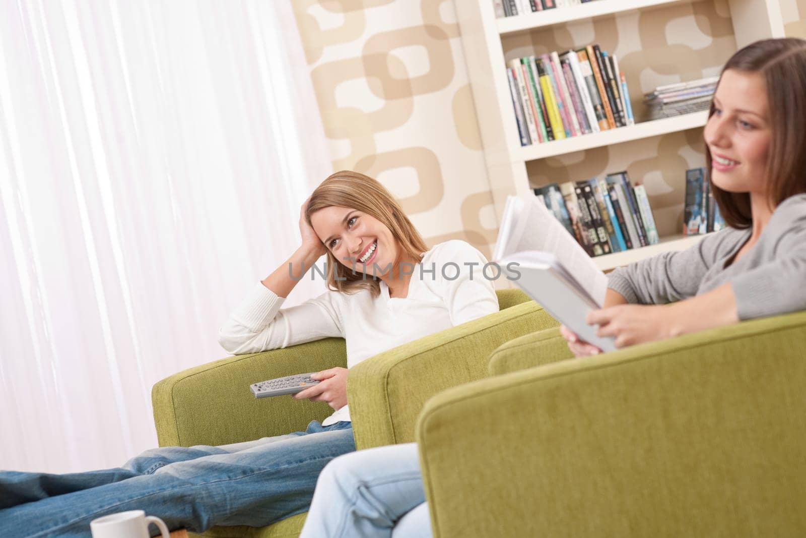Students - Two female student relaxing home