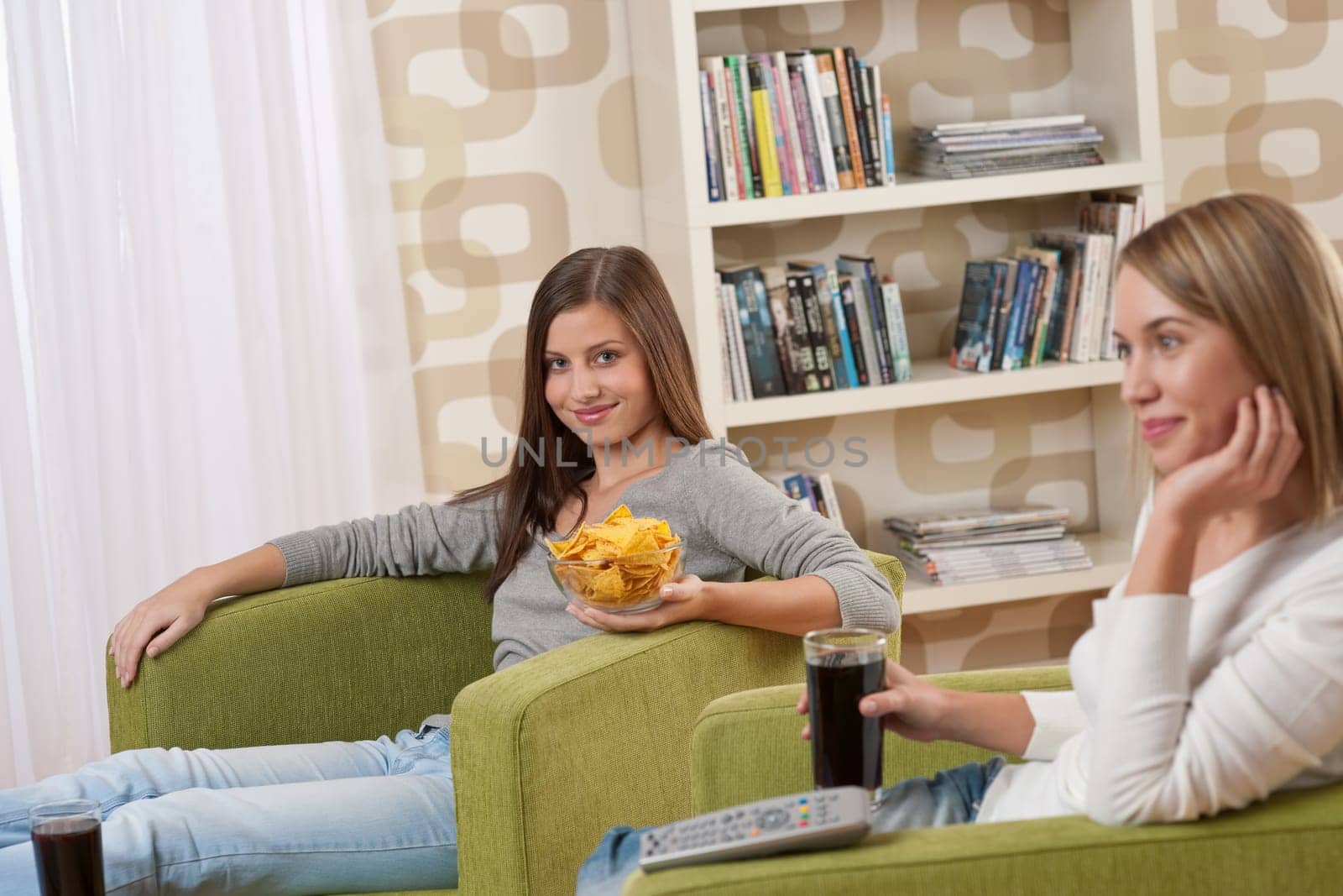 Two female students watching television