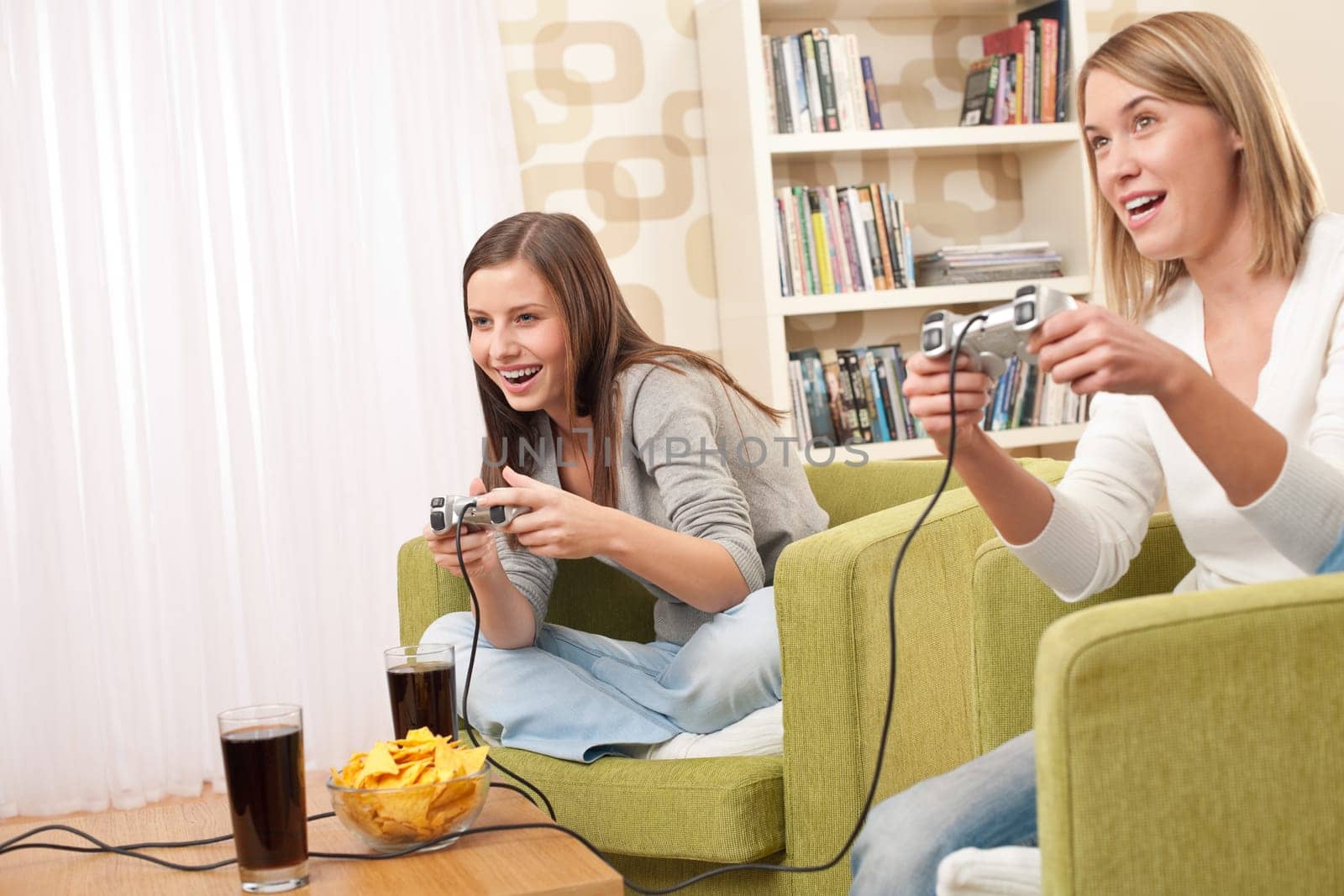 Two female students playing TV games