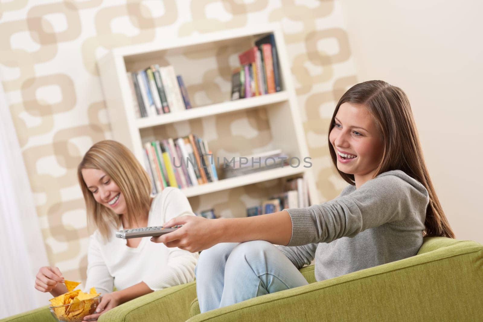 Two female students watching television