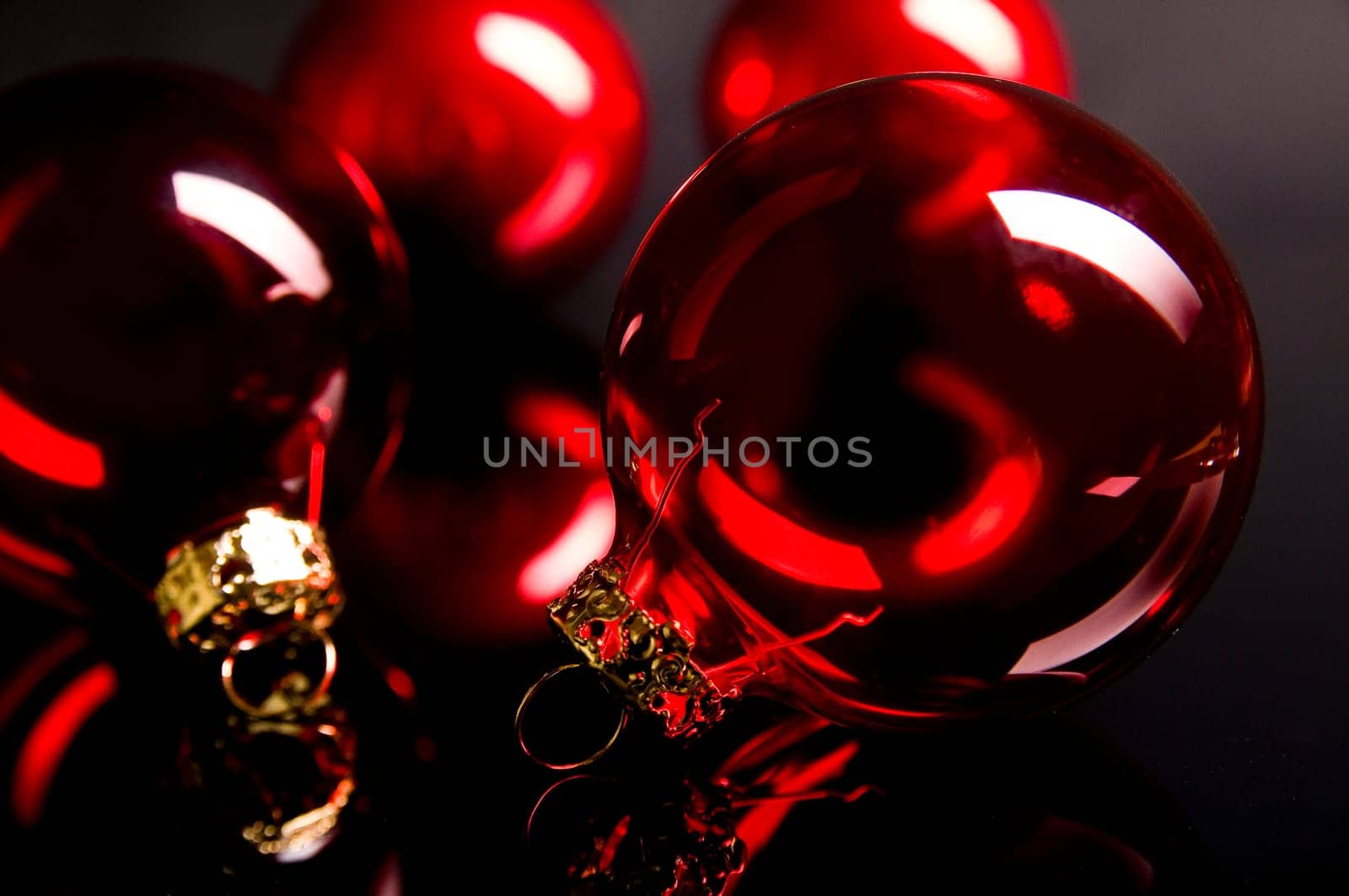 red christmas ball in front of dark background