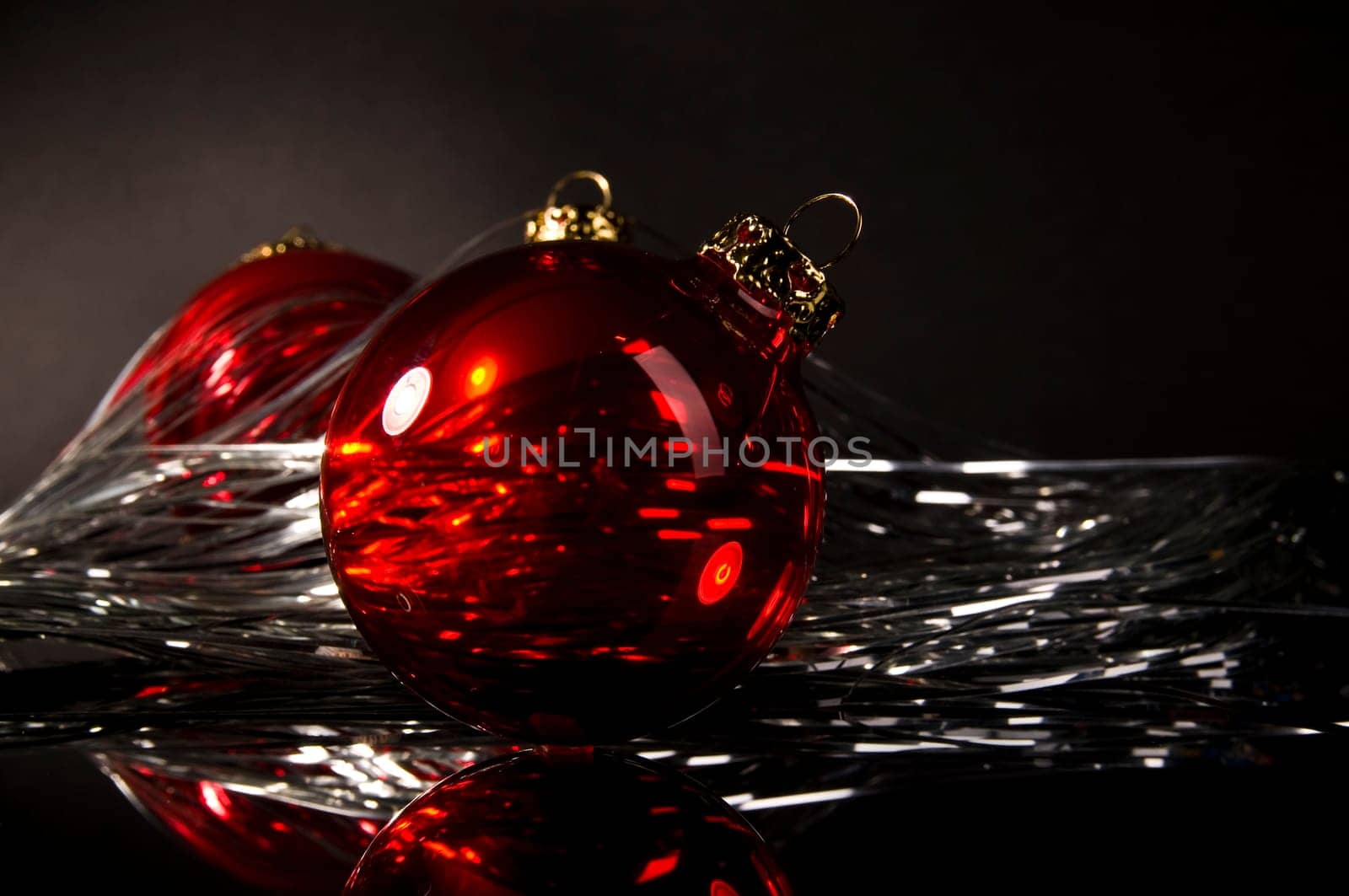red christmas ball in front of dark background