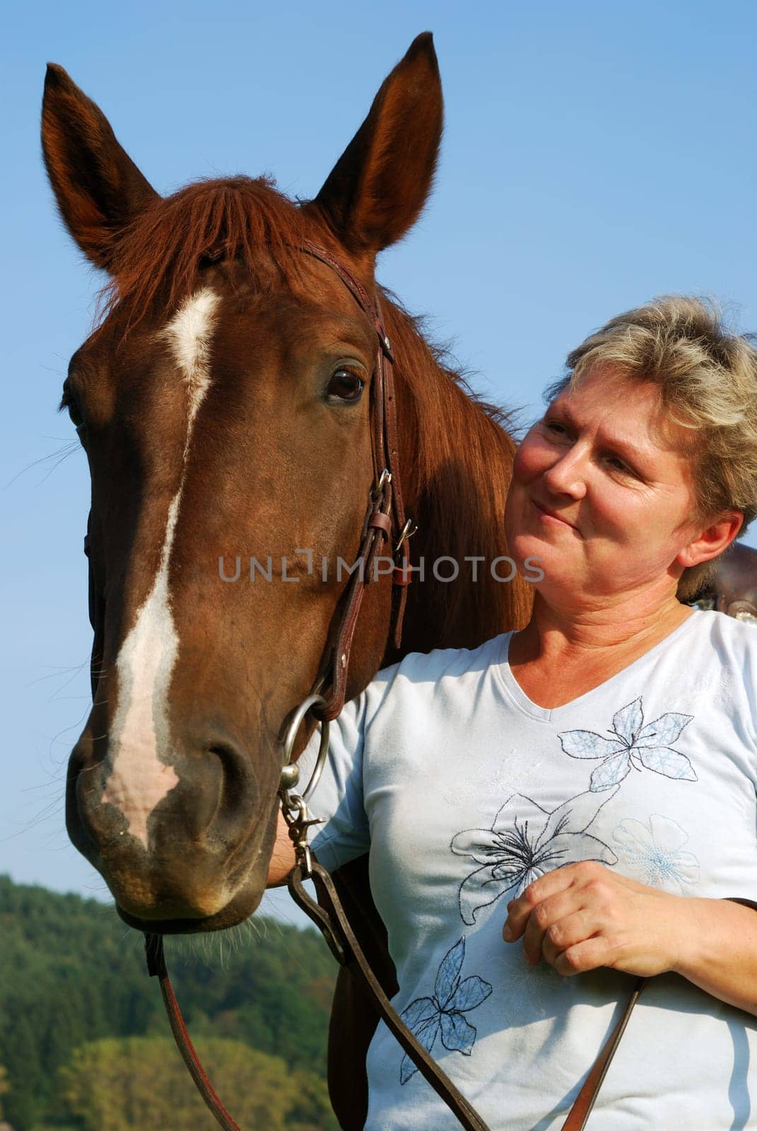 Woman with riding pony mare