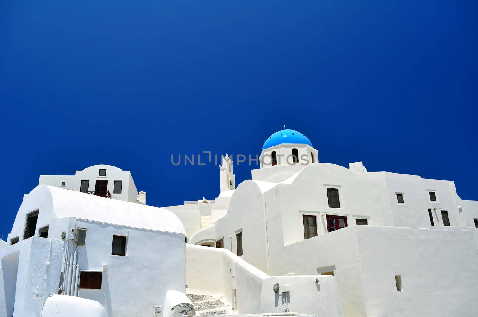Chapel and white houses in Santorini.