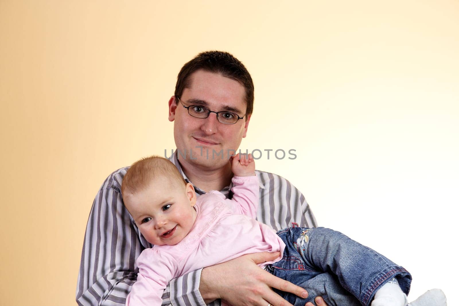 Father with daughter in his arms